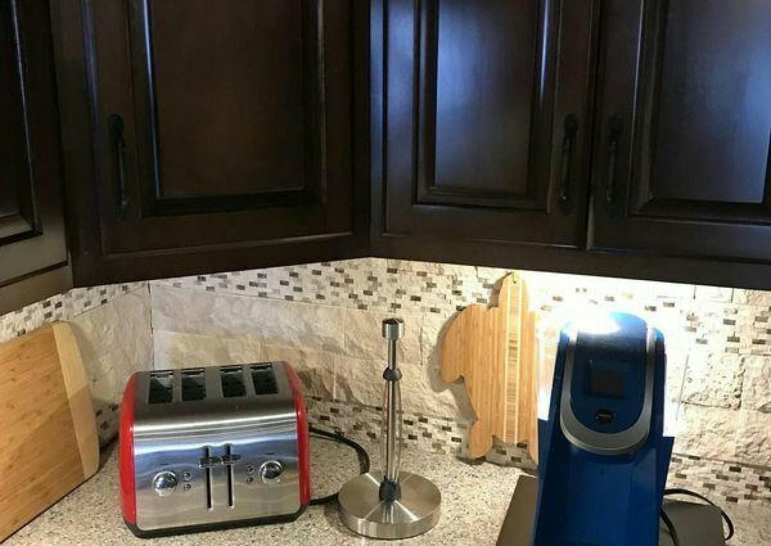 a kitchen counter with a toaster oven and a toaster oven aboard ST. SOMEWHERE Yacht for Sale