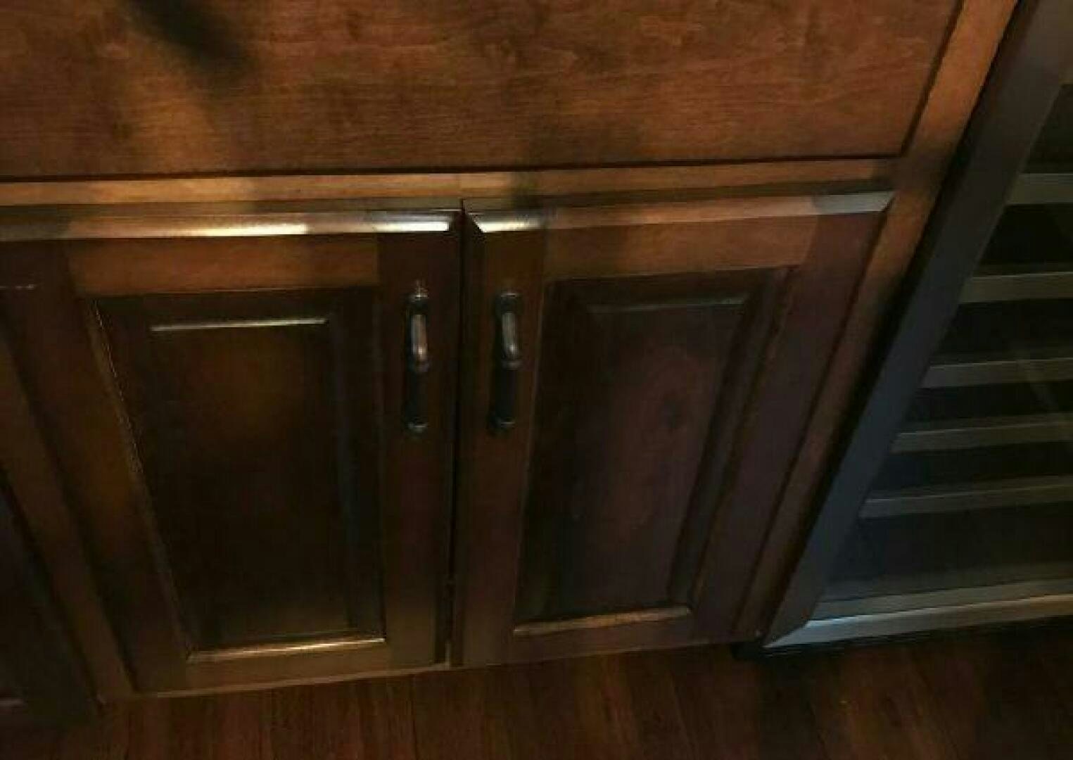 a wooden cabinet with a door aboard ST. SOMEWHERE Yacht for Sale