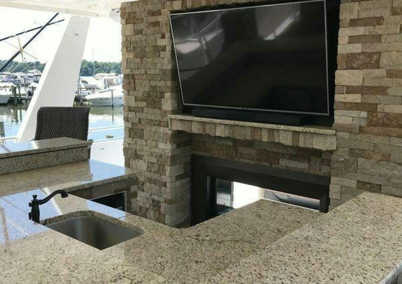a fireplace in a kitchen aboard ST. SOMEWHERE Yacht for Sale