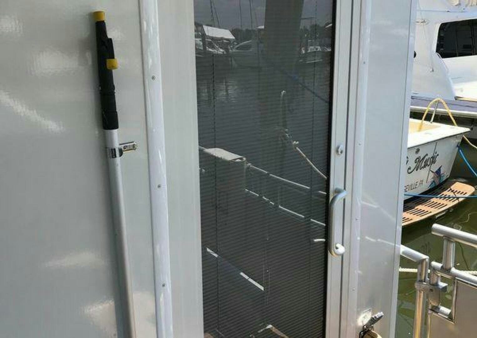 a metal door with a metal frame aboard ST. SOMEWHERE Yacht for Sale