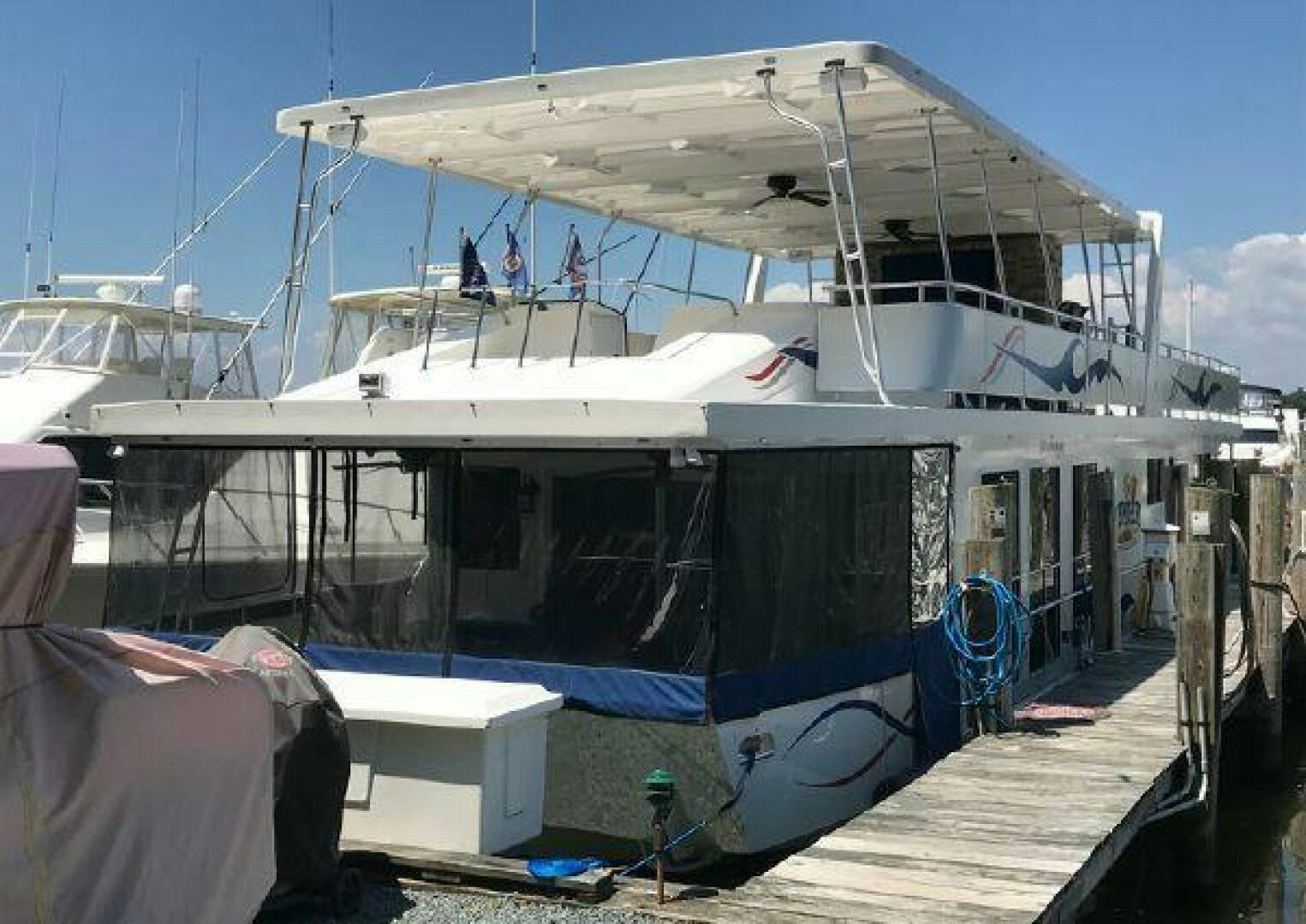 a boat docked at a pier aboard ST. SOMEWHERE Yacht for Sale