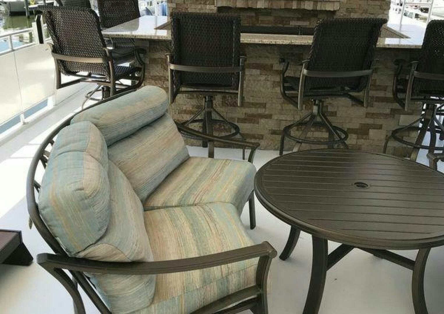 a chair and a table in a room aboard ST. SOMEWHERE Yacht for Sale