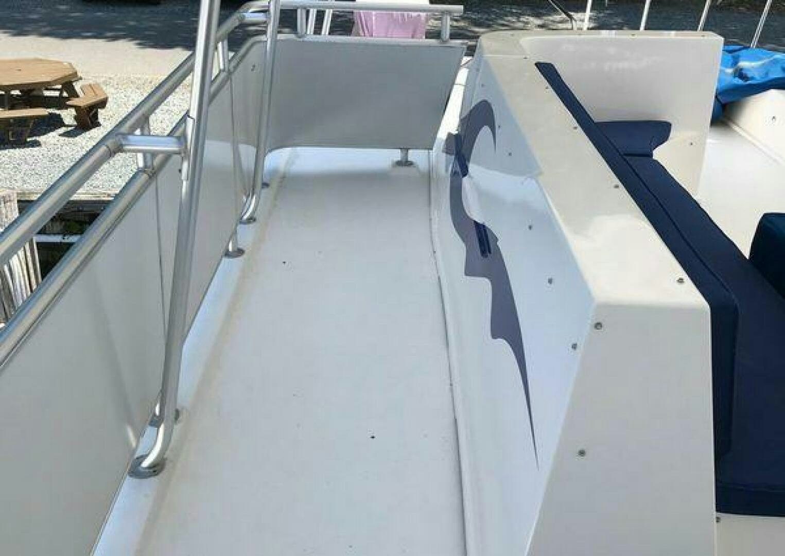 a close-up of a white metal railing aboard ST. SOMEWHERE Yacht for Sale