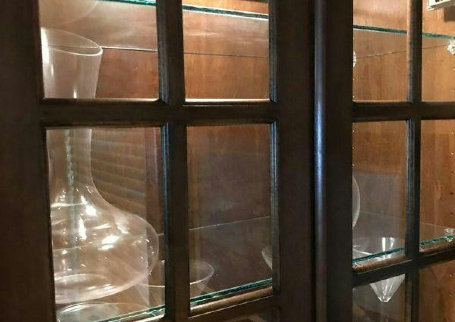 a glass window with a clear liquid aboard ST. SOMEWHERE Yacht for Sale