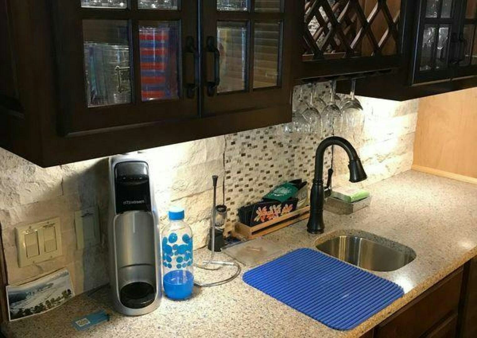 a kitchen counter with a sink and a faucet aboard ST. SOMEWHERE Yacht for Sale