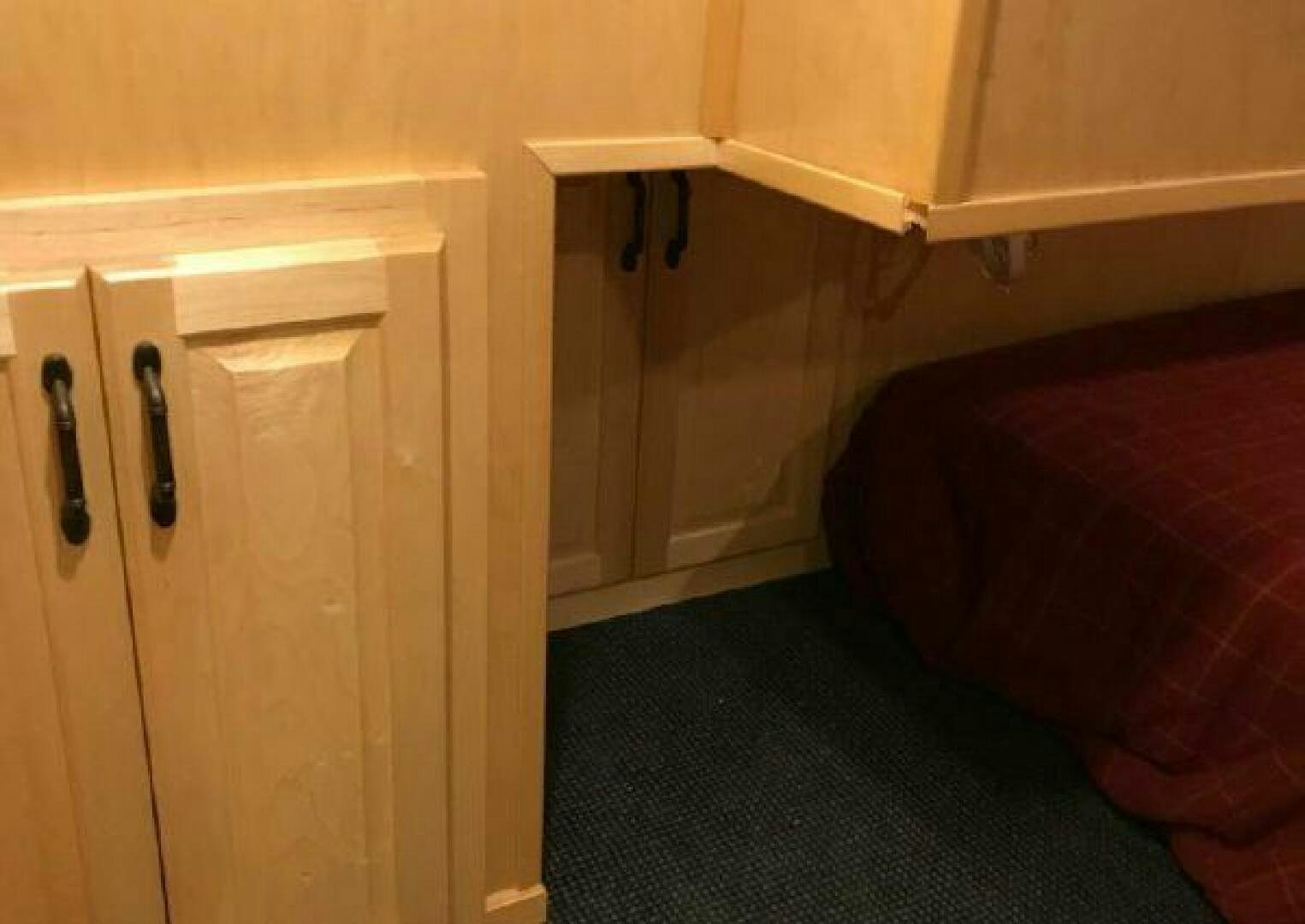 a room with a bed and a closet aboard ST. SOMEWHERE Yacht for Sale