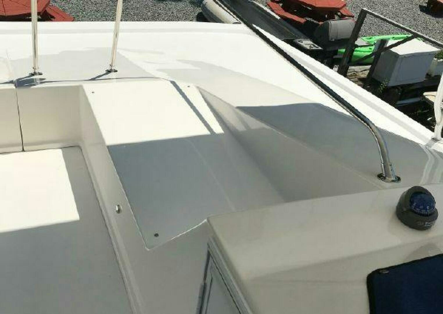 a white rectangular object with a blue circle on it aboard ST. SOMEWHERE Yacht for Sale