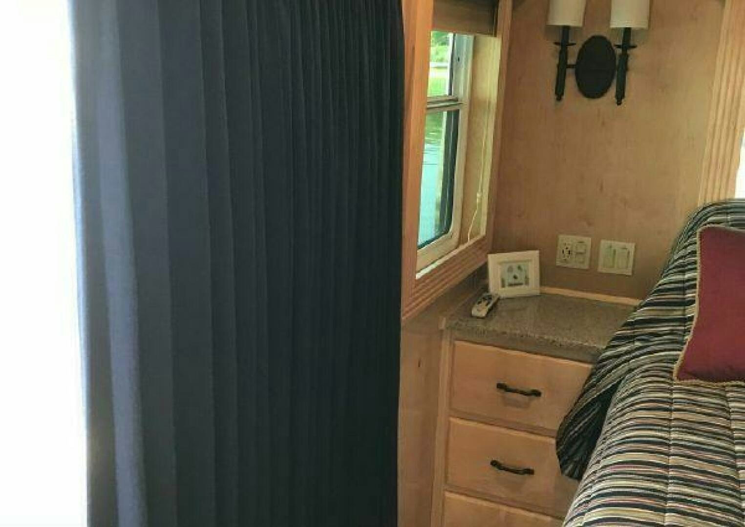 a room with a bed and a desk aboard ST. SOMEWHERE Yacht for Sale