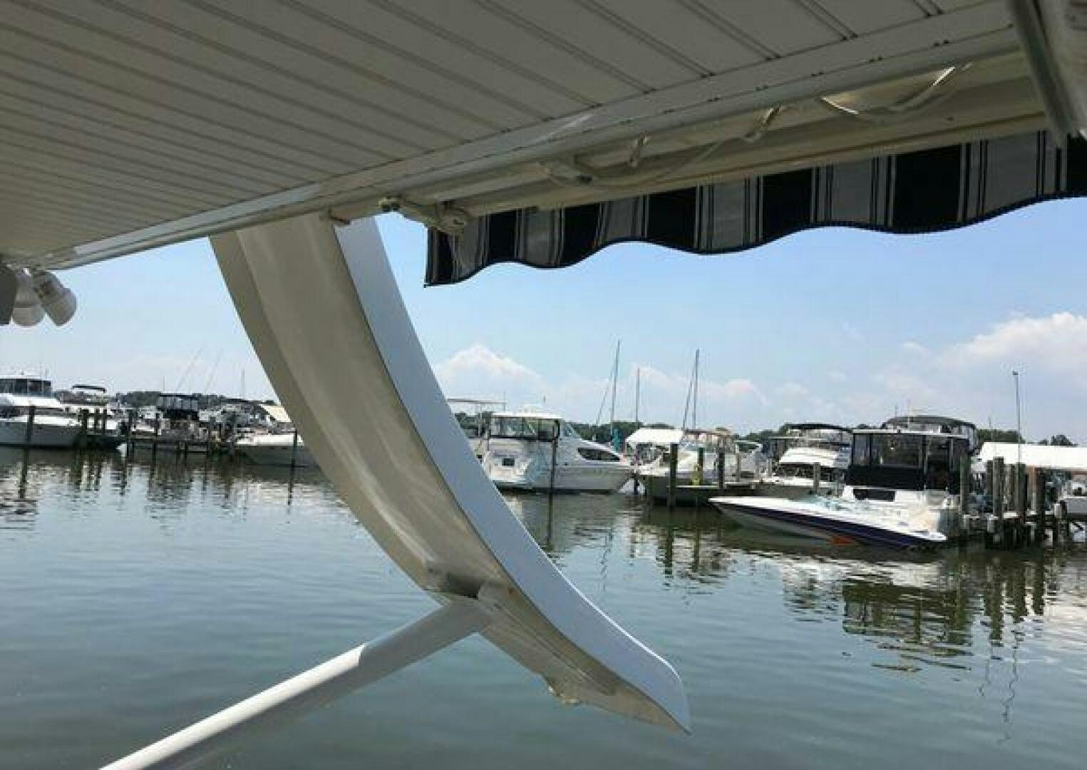 a bridge over water with boats aboard ST. SOMEWHERE Yacht for Sale
