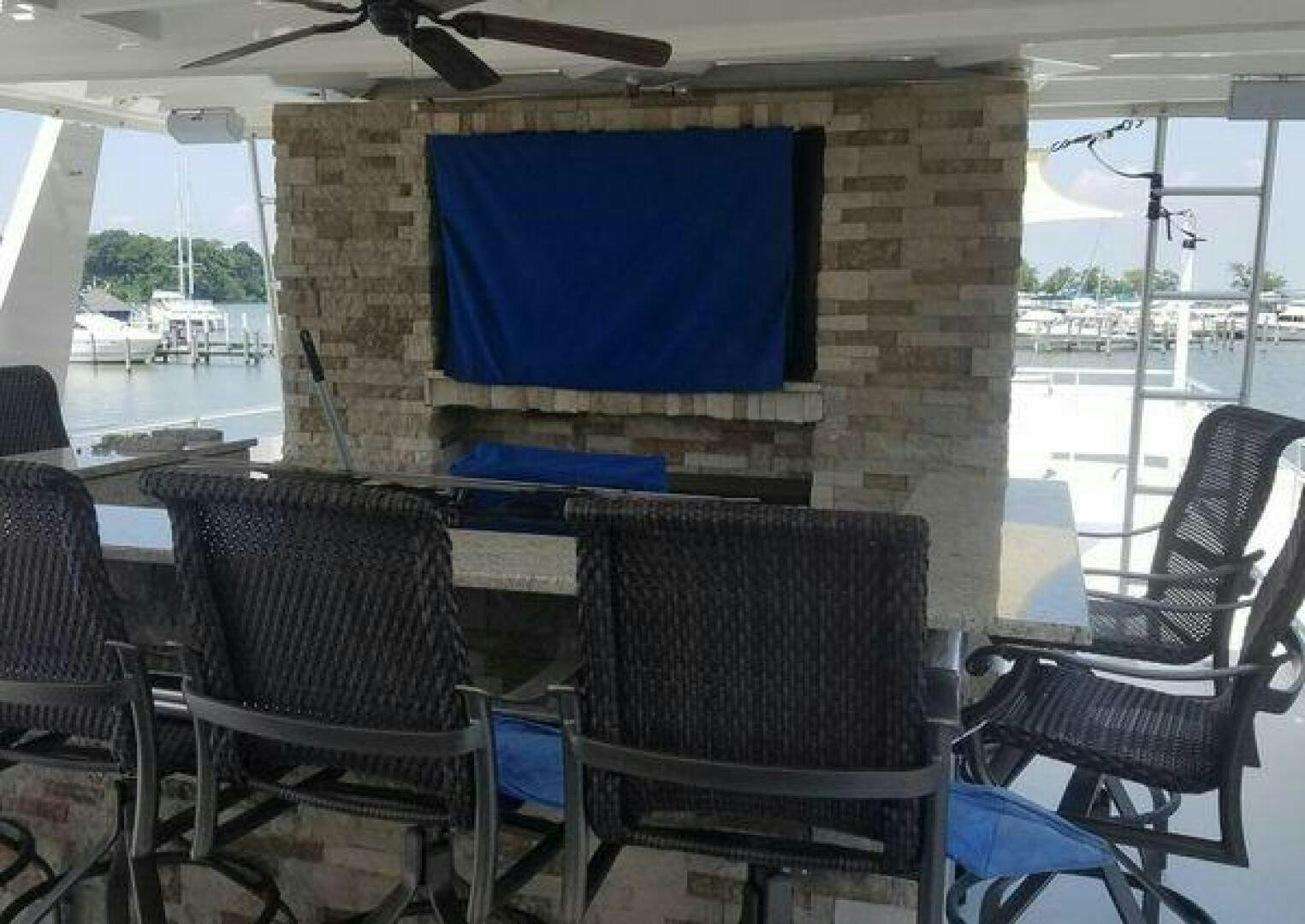 a room with chairs and a blue screen aboard ST. SOMEWHERE Yacht for Sale