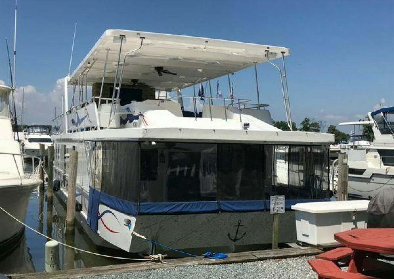 a boat docked at a pier aboard ST. SOMEWHERE Yacht for Sale