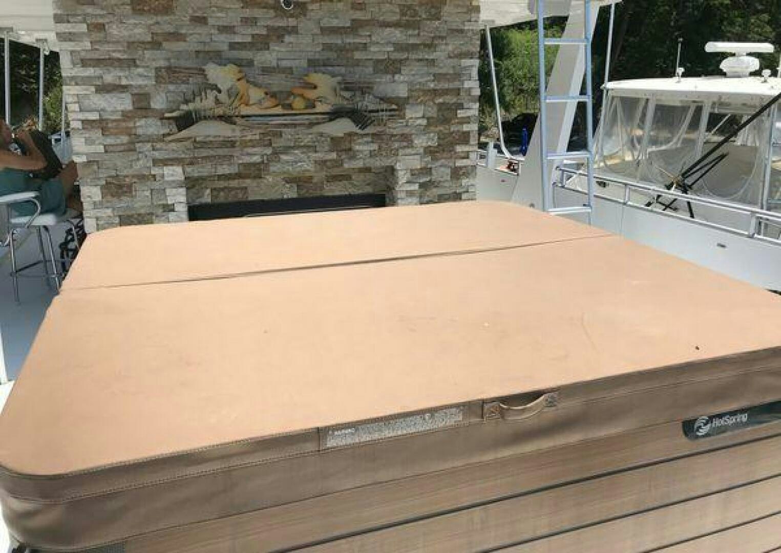 a wooden rectangular object with a wood surface and a brick wall behind it aboard ST. SOMEWHERE Yacht for Sale