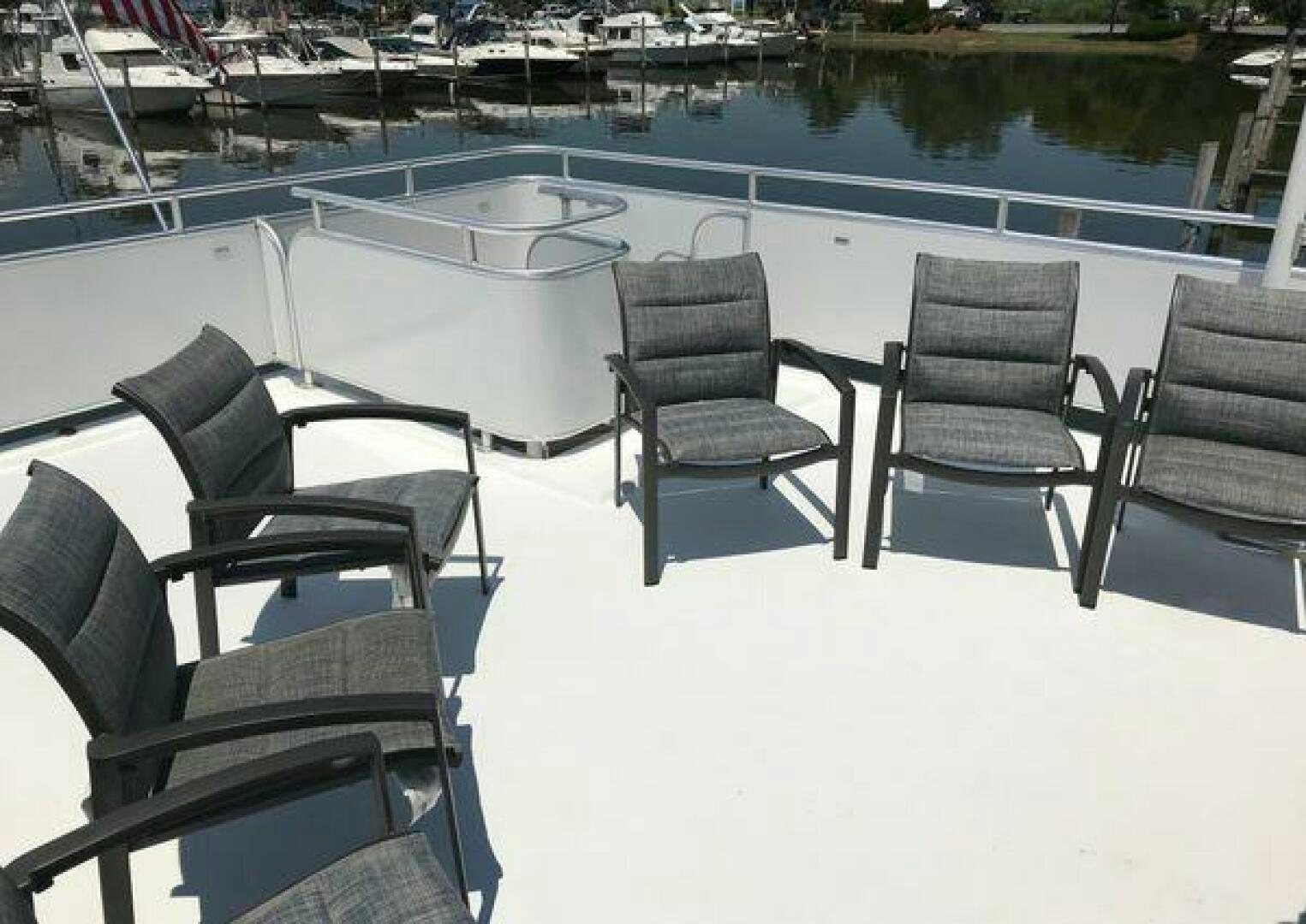 chairs around a pool aboard ST. SOMEWHERE Yacht for Sale