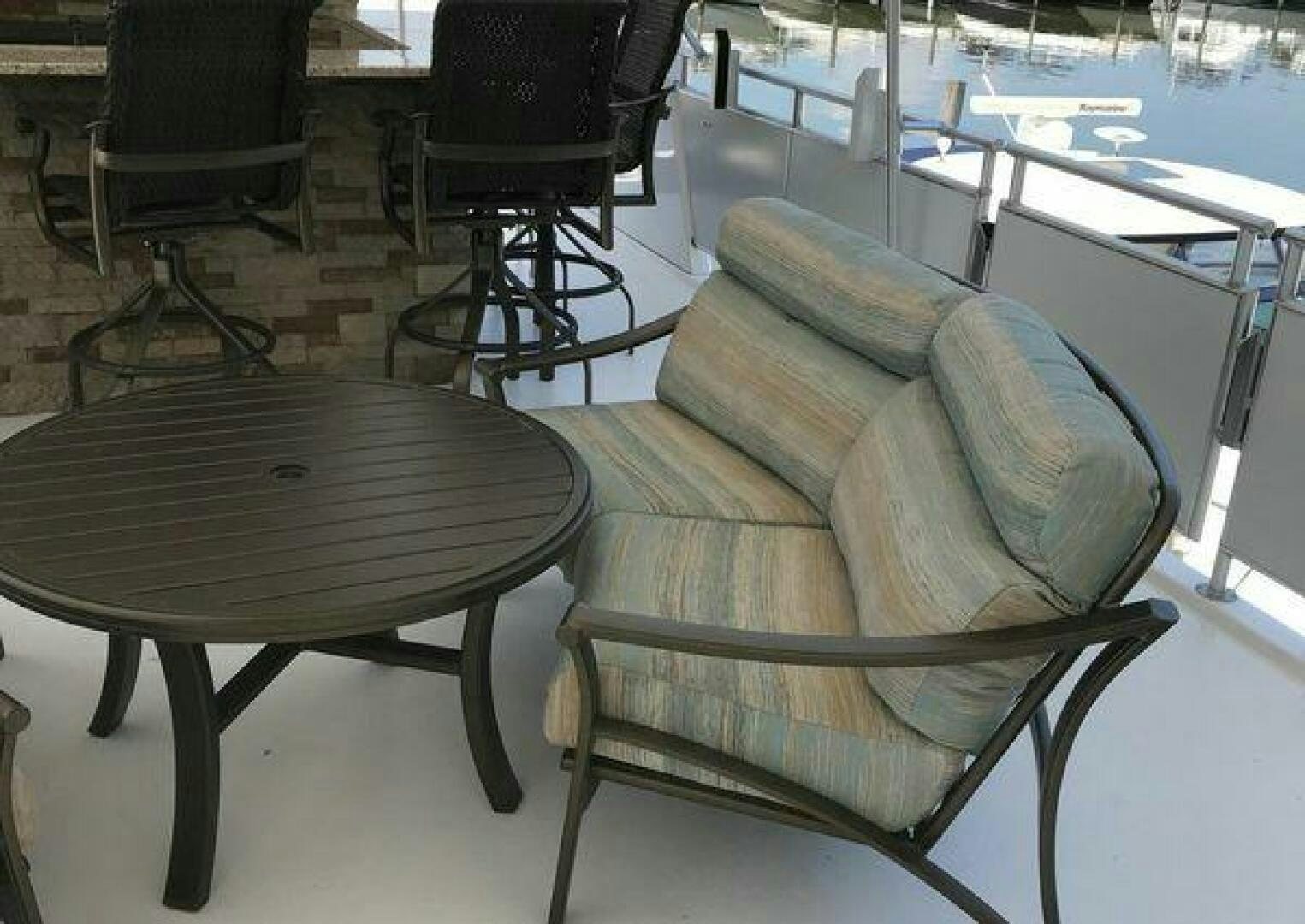 a chair and a table in a room aboard ST. SOMEWHERE Yacht for Sale