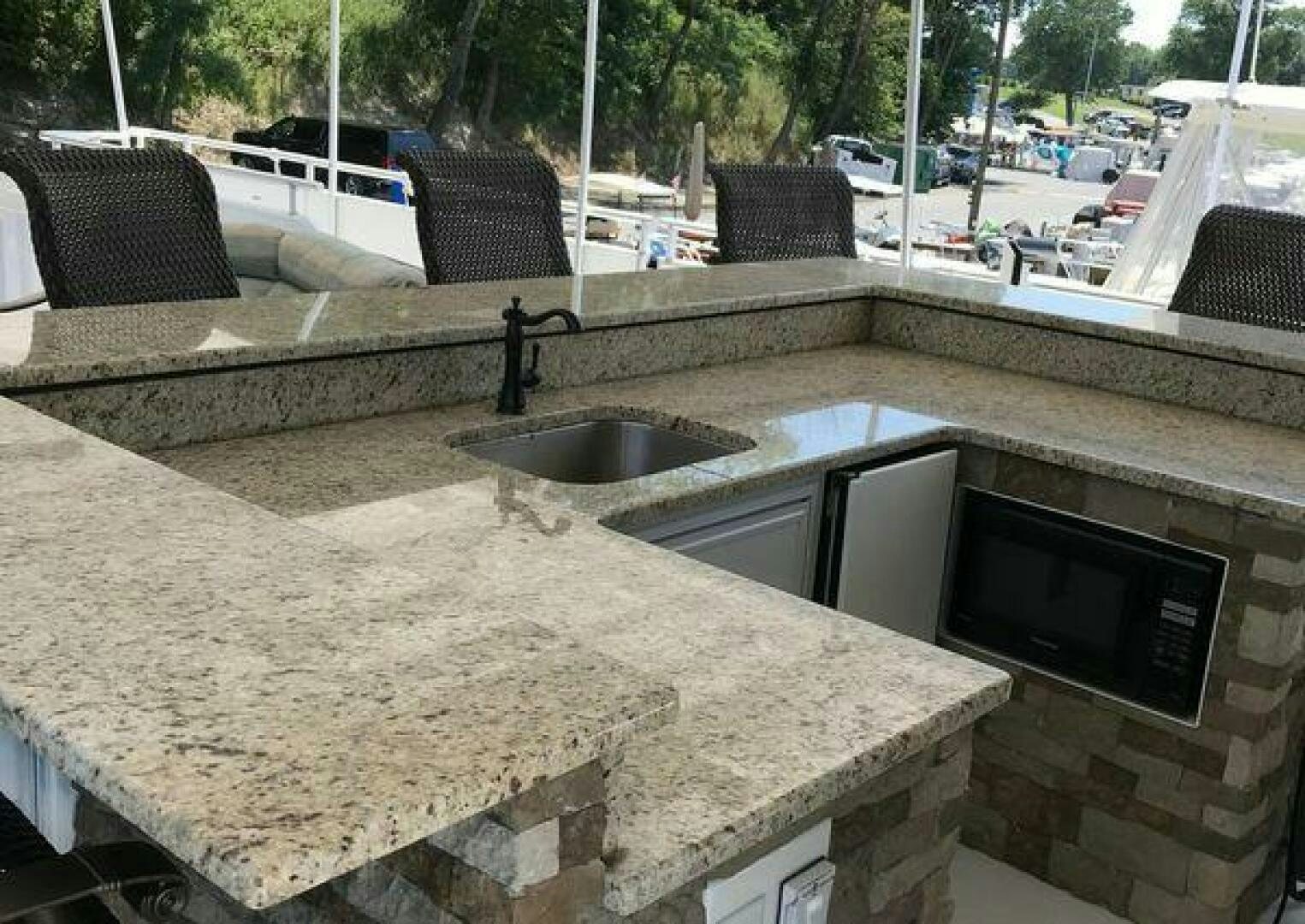 a kitchen with a sink and a microwave aboard ST. SOMEWHERE Yacht for Sale