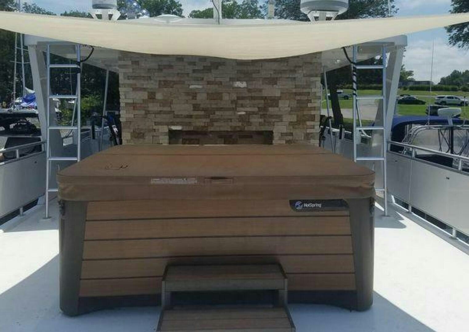 a wood table on a deck aboard ST. SOMEWHERE Yacht for Sale