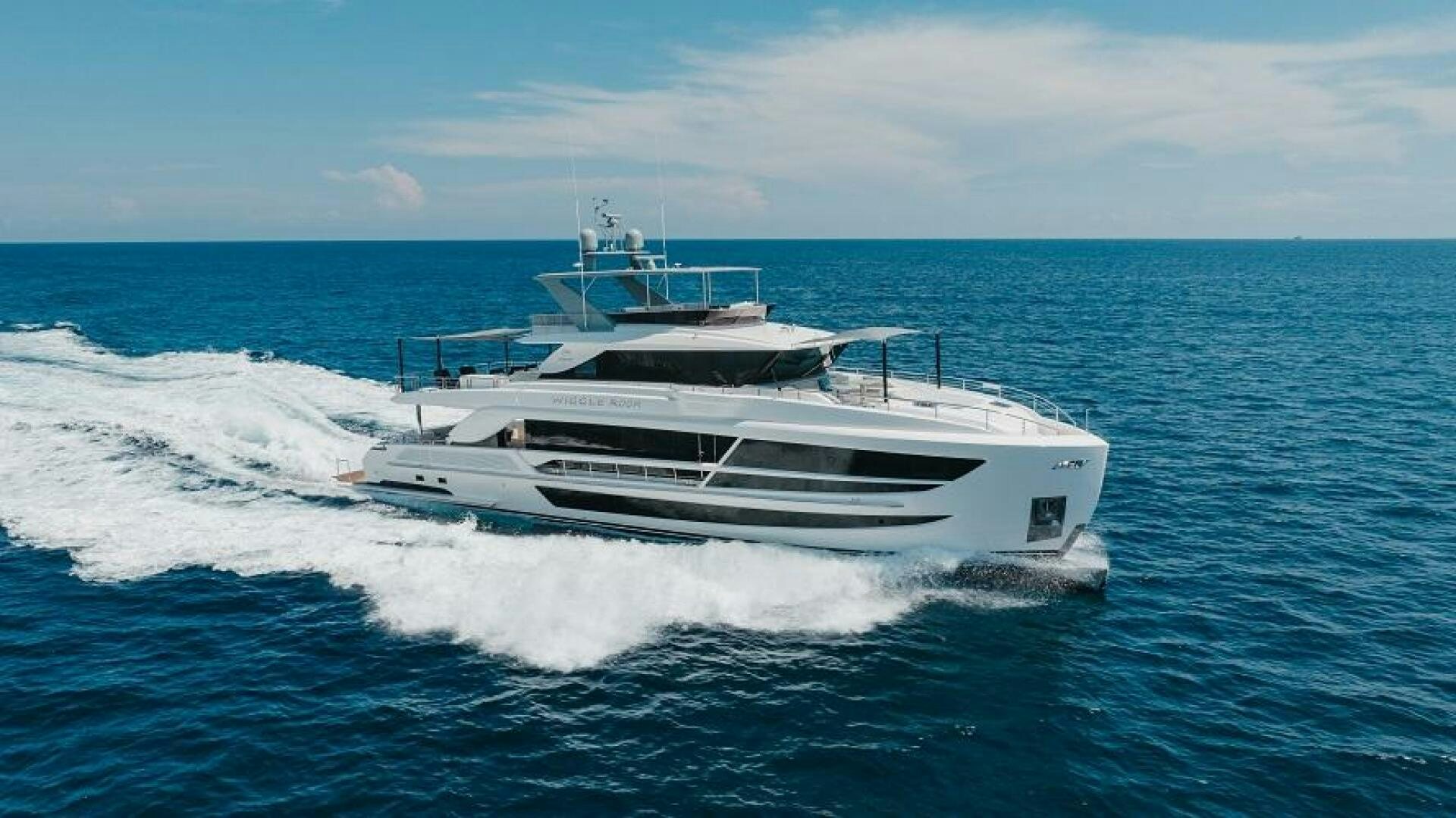 a white yacht on the water aboard WIGGLE ROOM Yacht for Sale