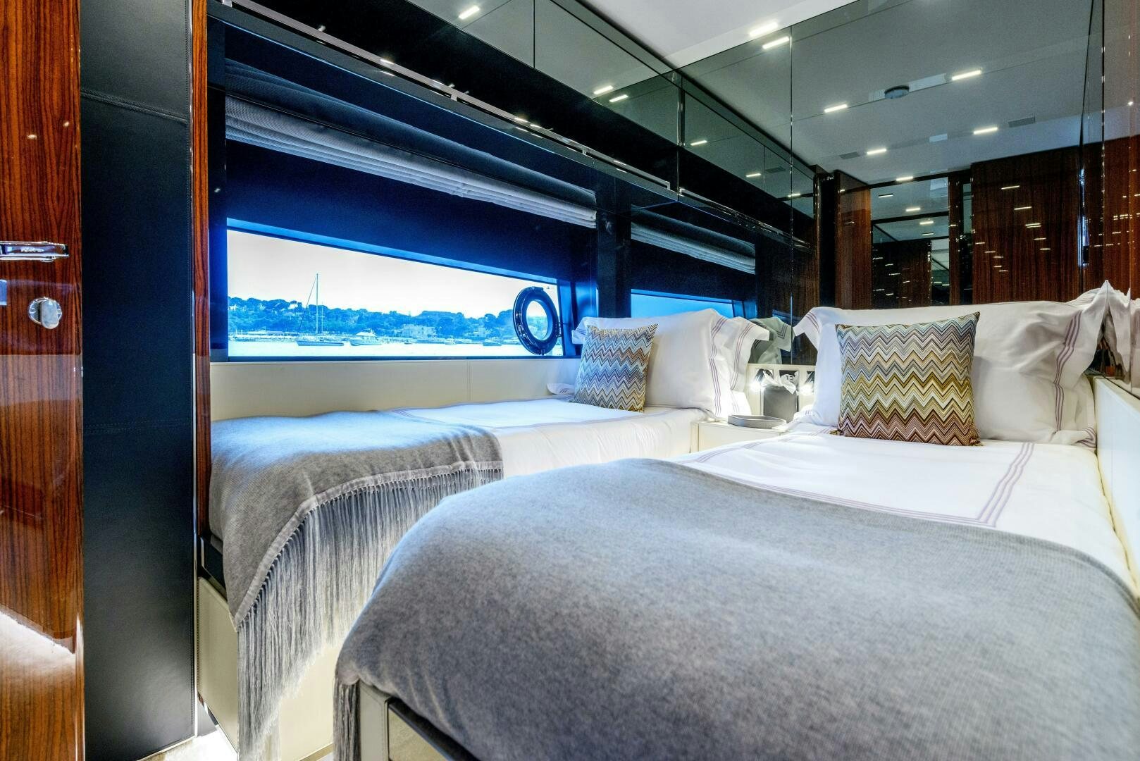 a room with beds and a window aboard GECUA Yacht for Sale