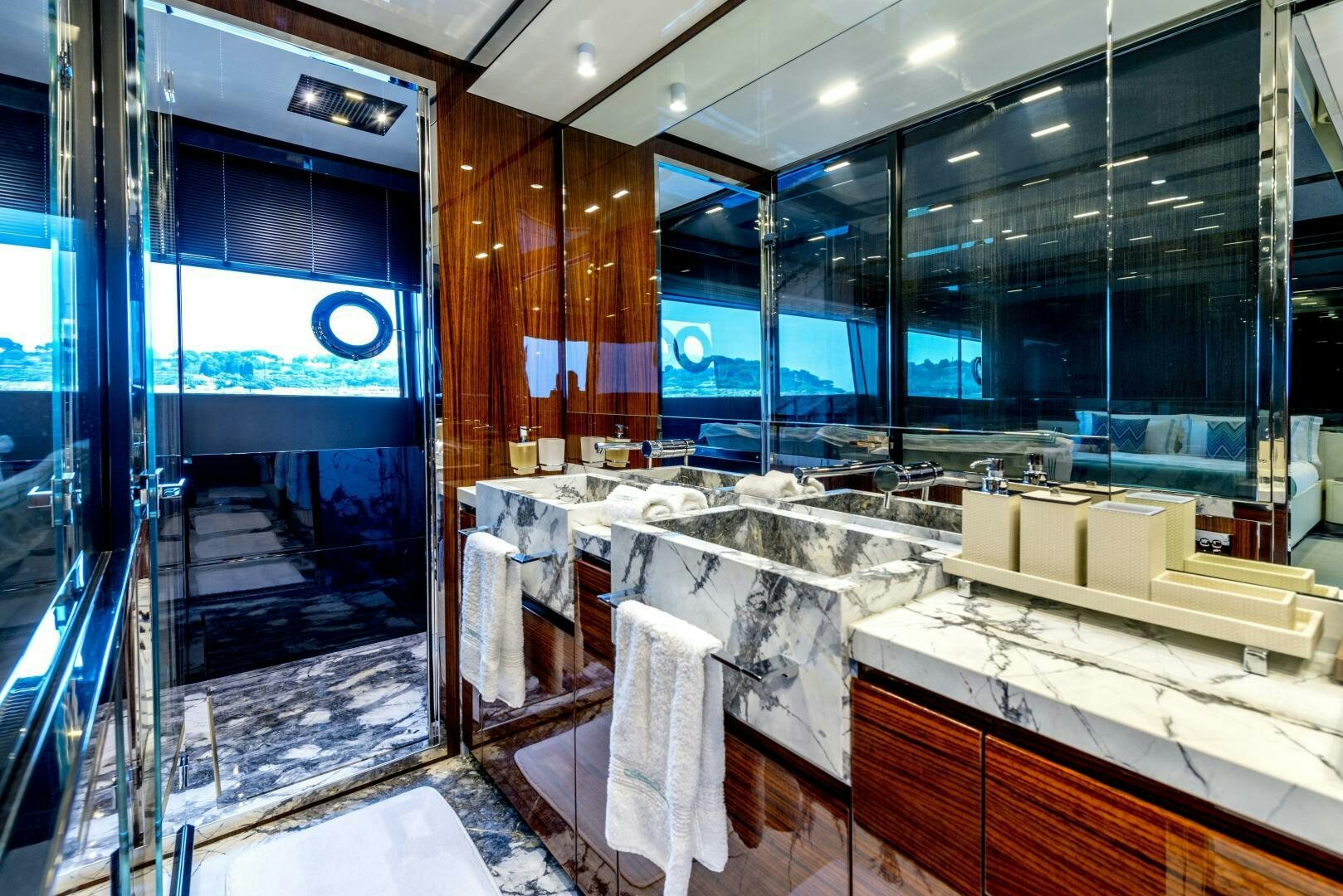 a large bathroom with a large glass window aboard GECUA Yacht for Sale