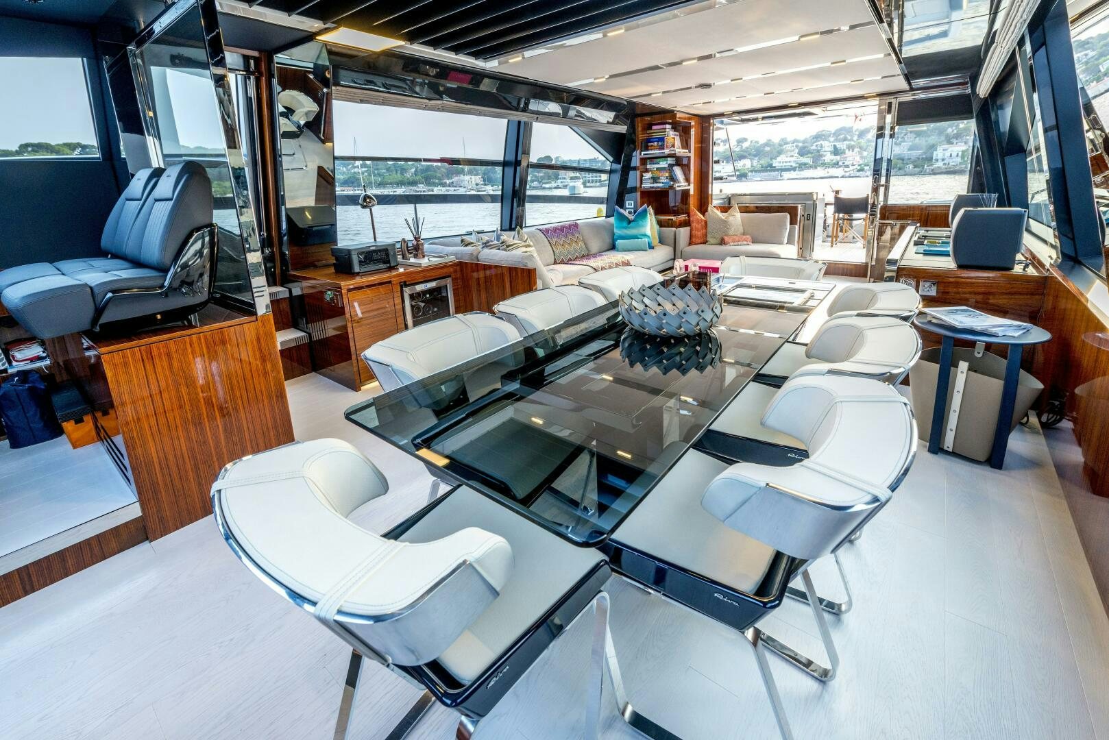 a room with a table chairs and a large window aboard GECUA Yacht for Sale