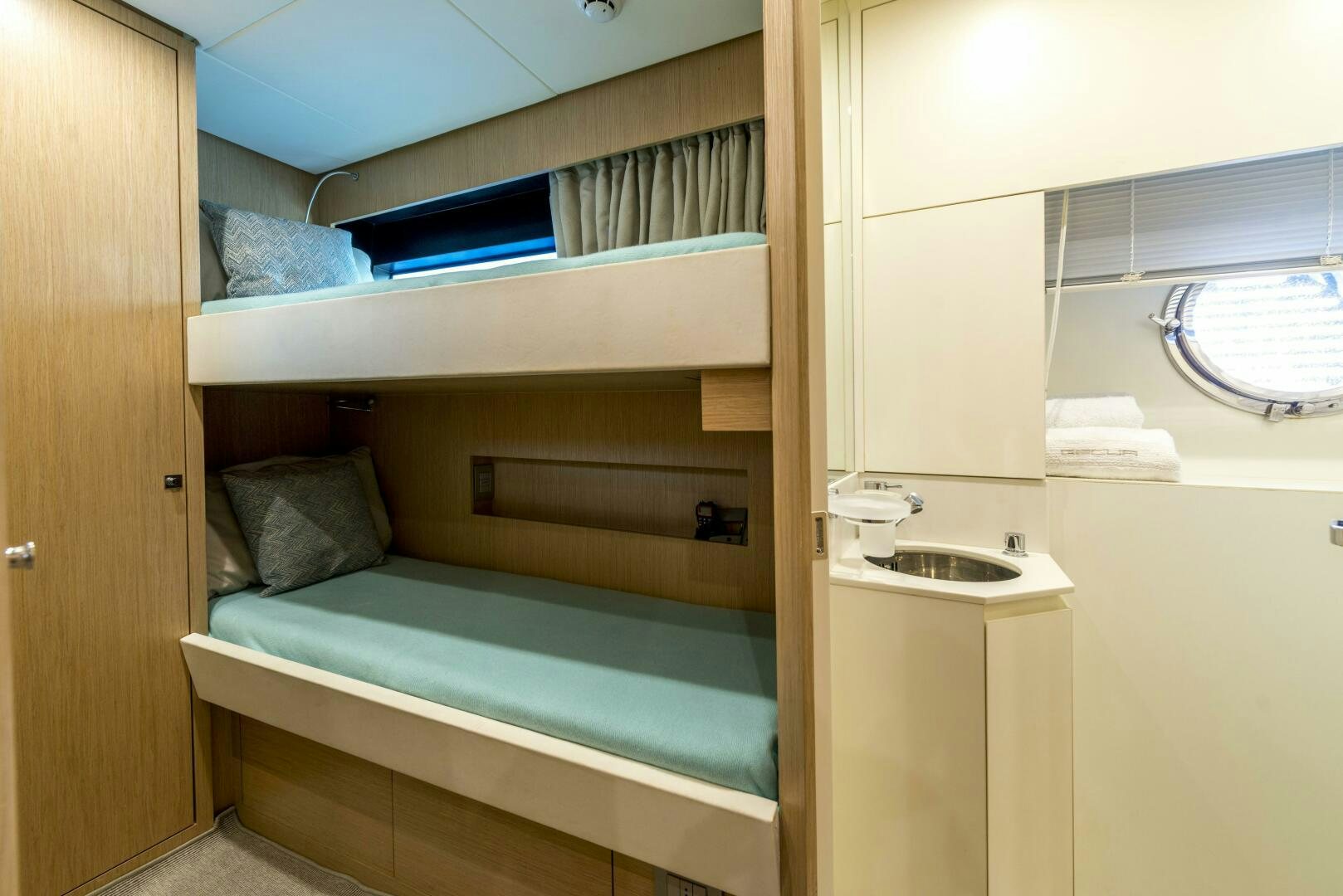 a bed with a blue bed frame aboard GECUA Yacht for Sale