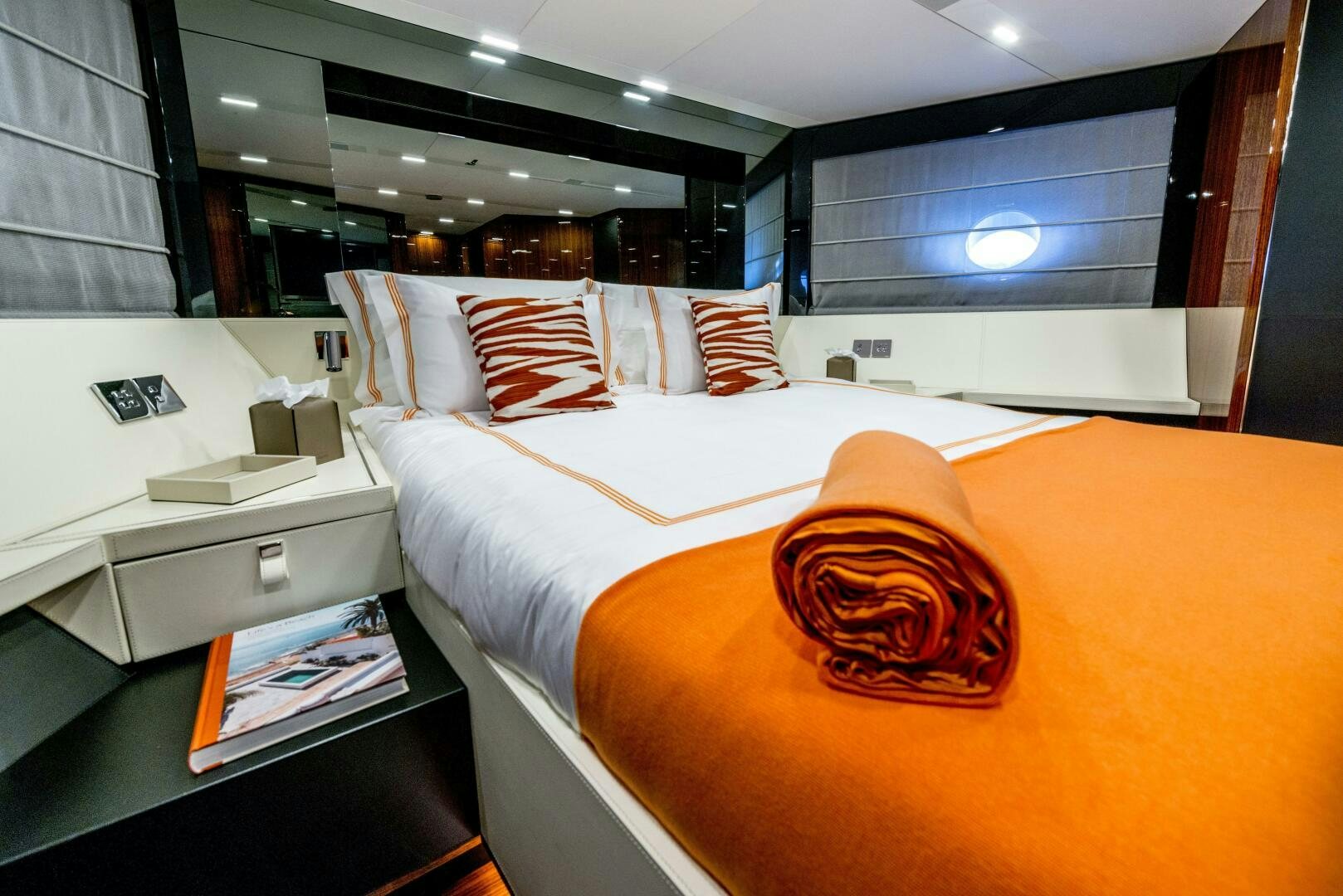 a room with a bed and a desk aboard GECUA Yacht for Sale