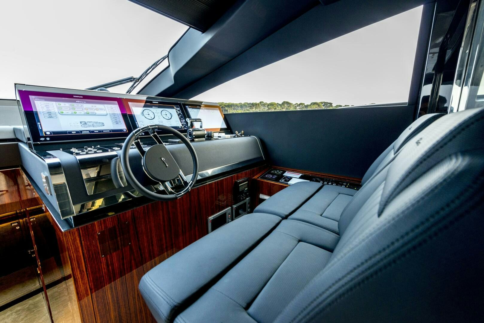 a car with a screen and speakers aboard GECUA Yacht for Sale
