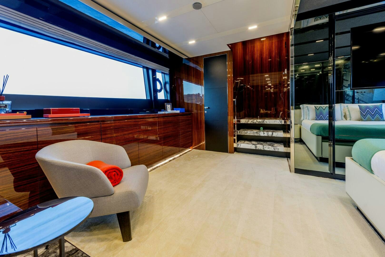 a room with a couch and a table and a chair aboard GECUA Yacht for Sale