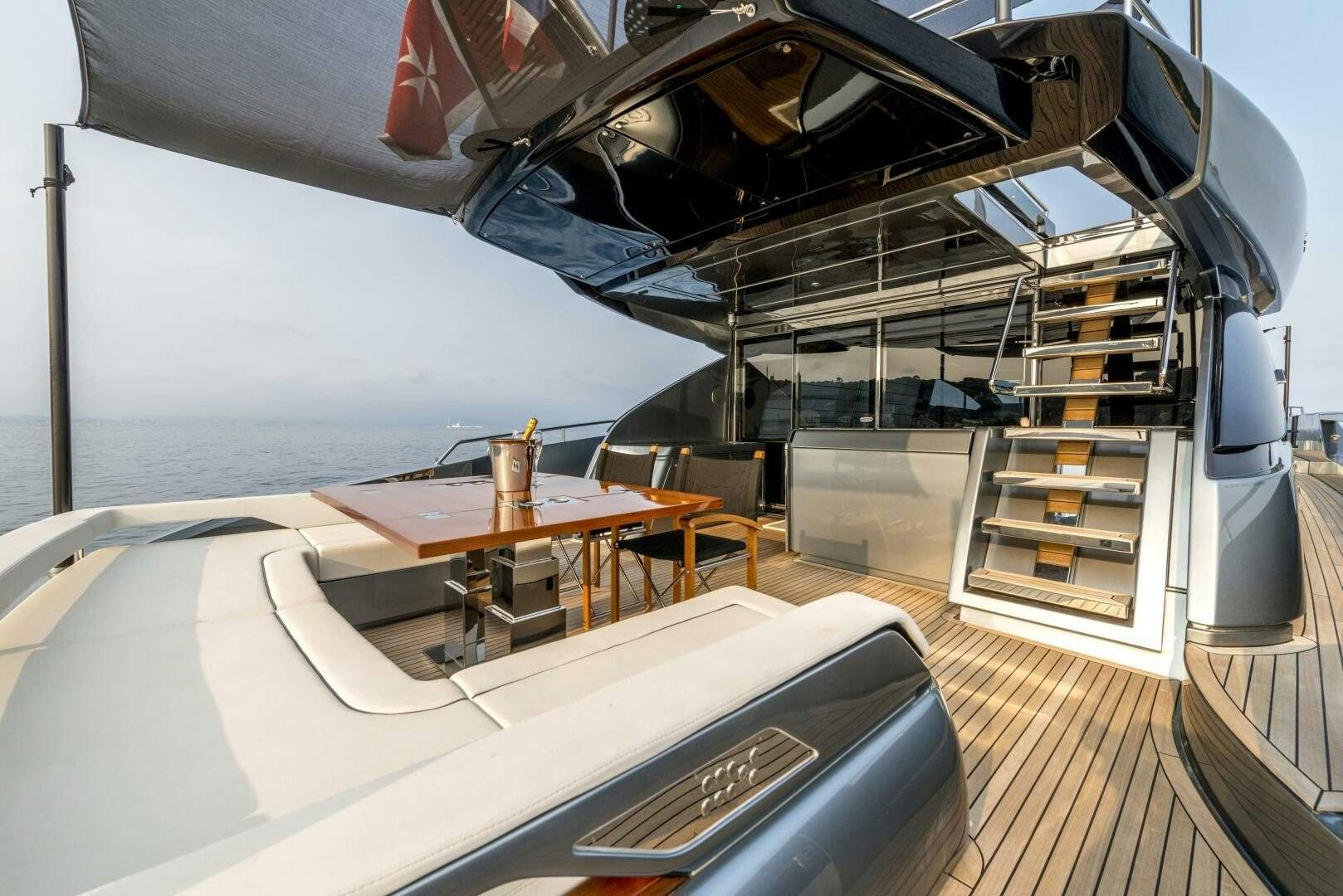 a large white boat with a desk aboard GECUA Yacht for Sale