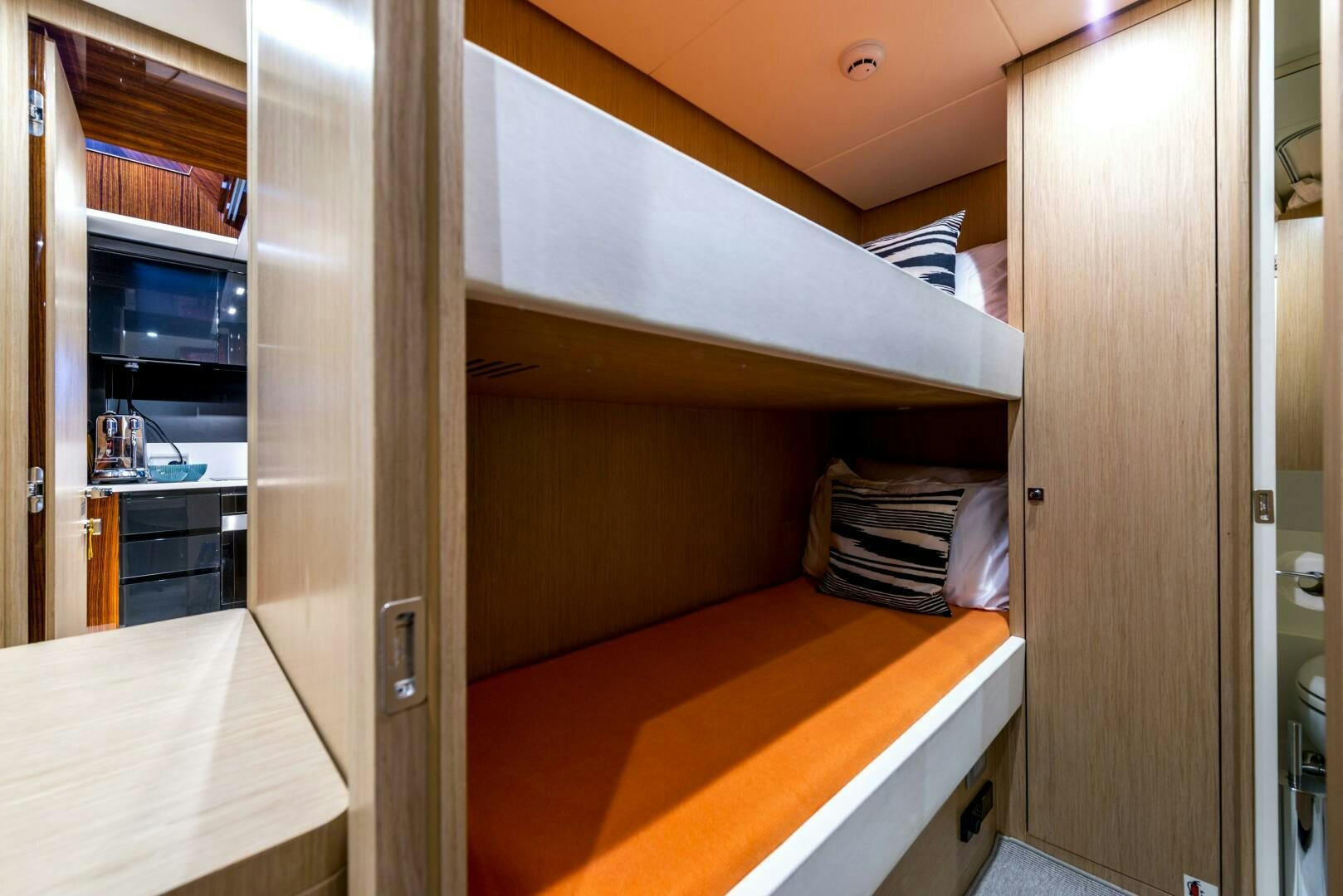 a room with a desk and a bed aboard GECUA Yacht for Sale