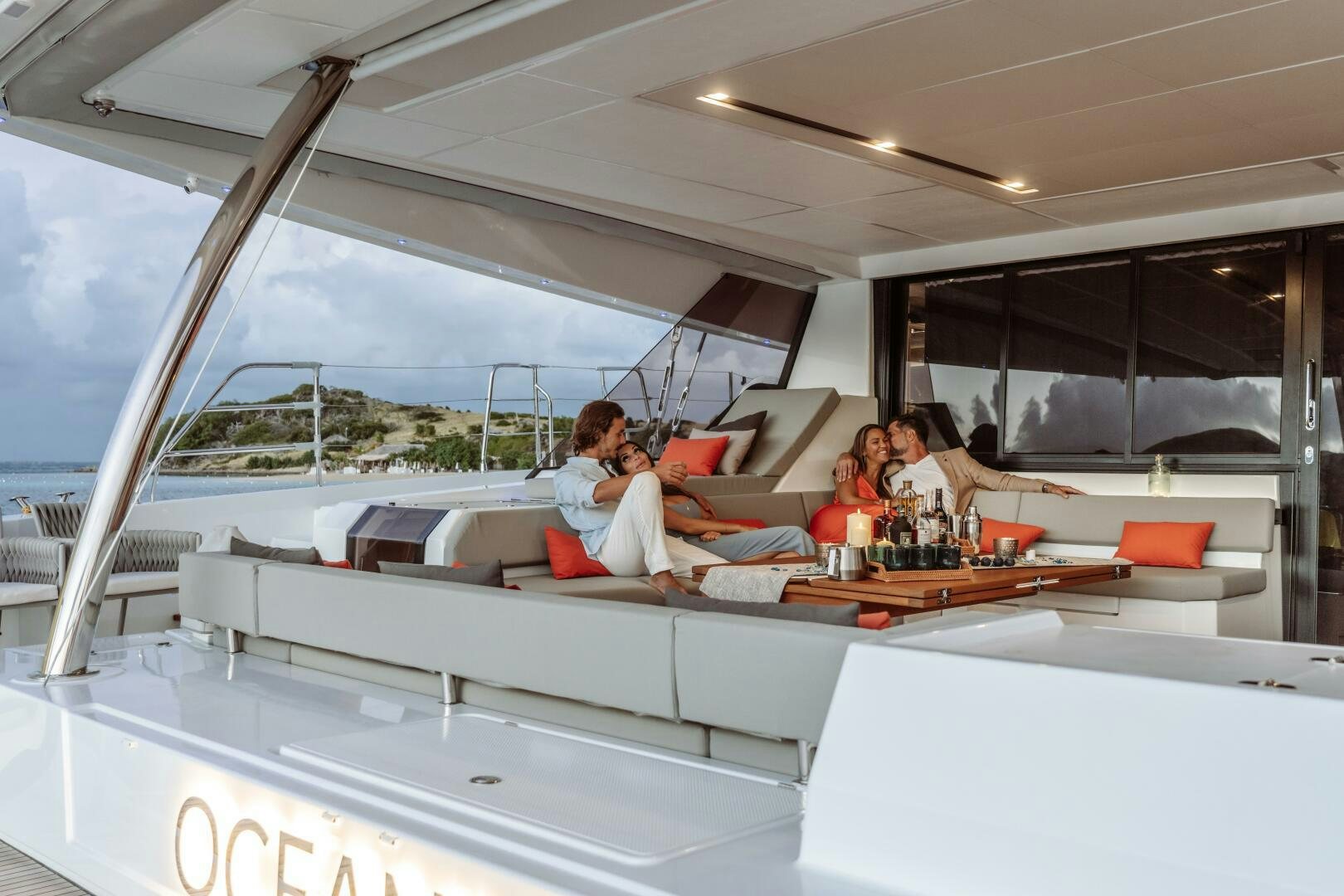 a group of people sitting at a table aboard OCEANUS Yacht for Sale