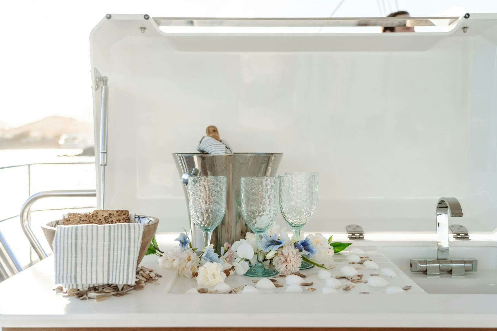 a table with a basket of flowers aboard OCEANUS Yacht for Sale