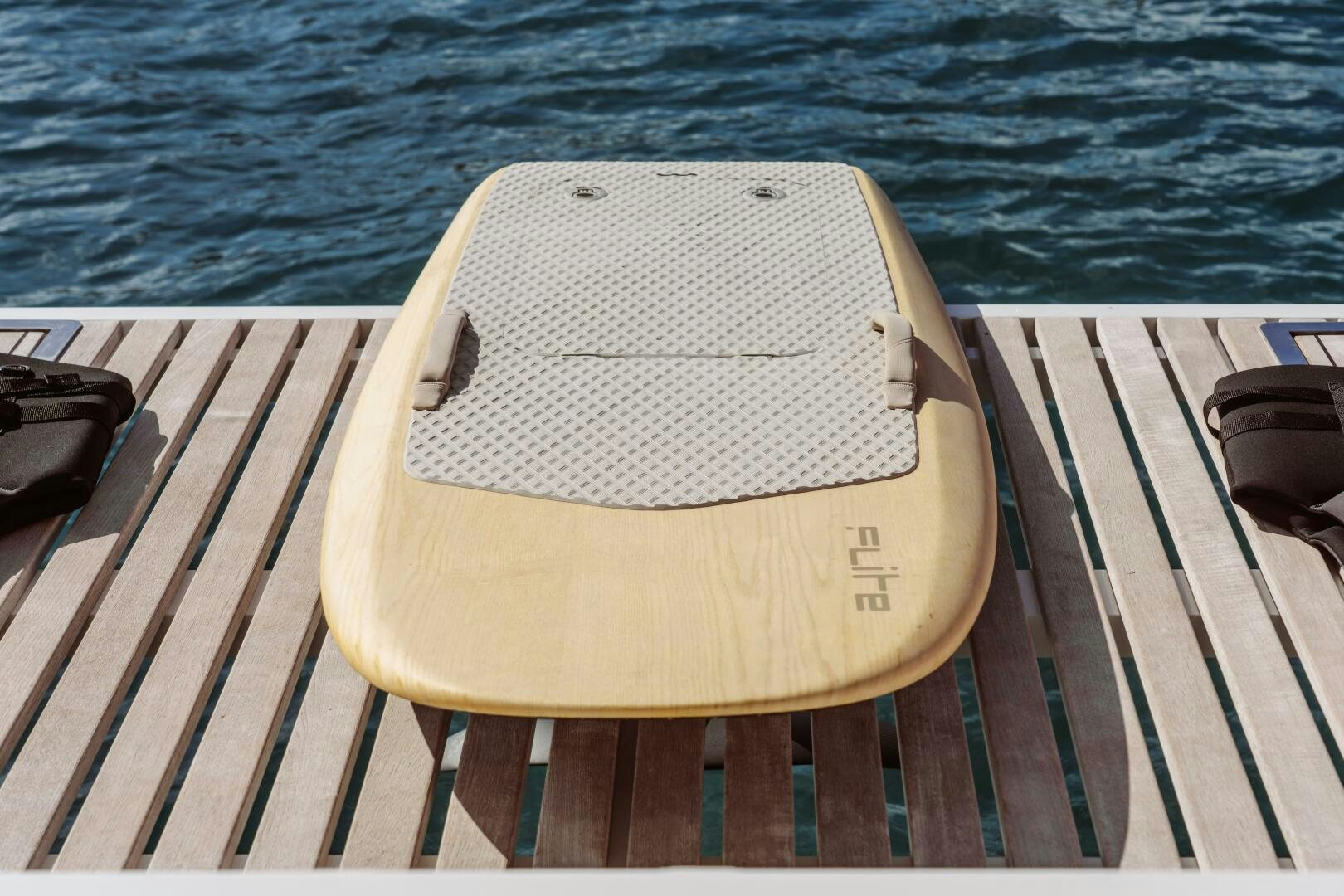 a white towel on a wooden dock aboard OCEANUS Yacht for Sale