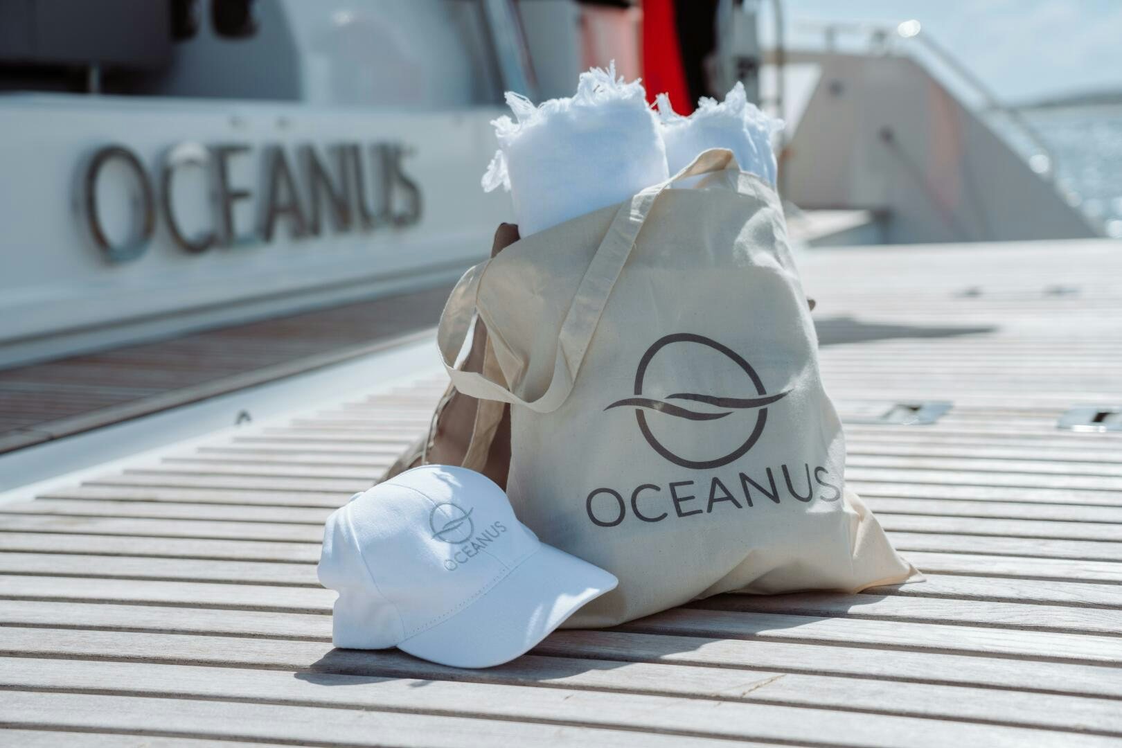a white hat with a white bow on a wooden surface aboard OCEANUS Yacht for Sale