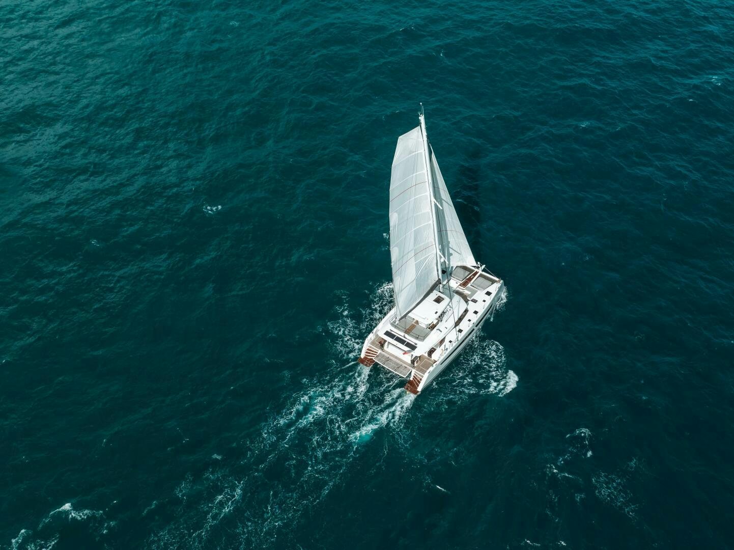 a boat in the ocean aboard OCEANUS Yacht for Sale