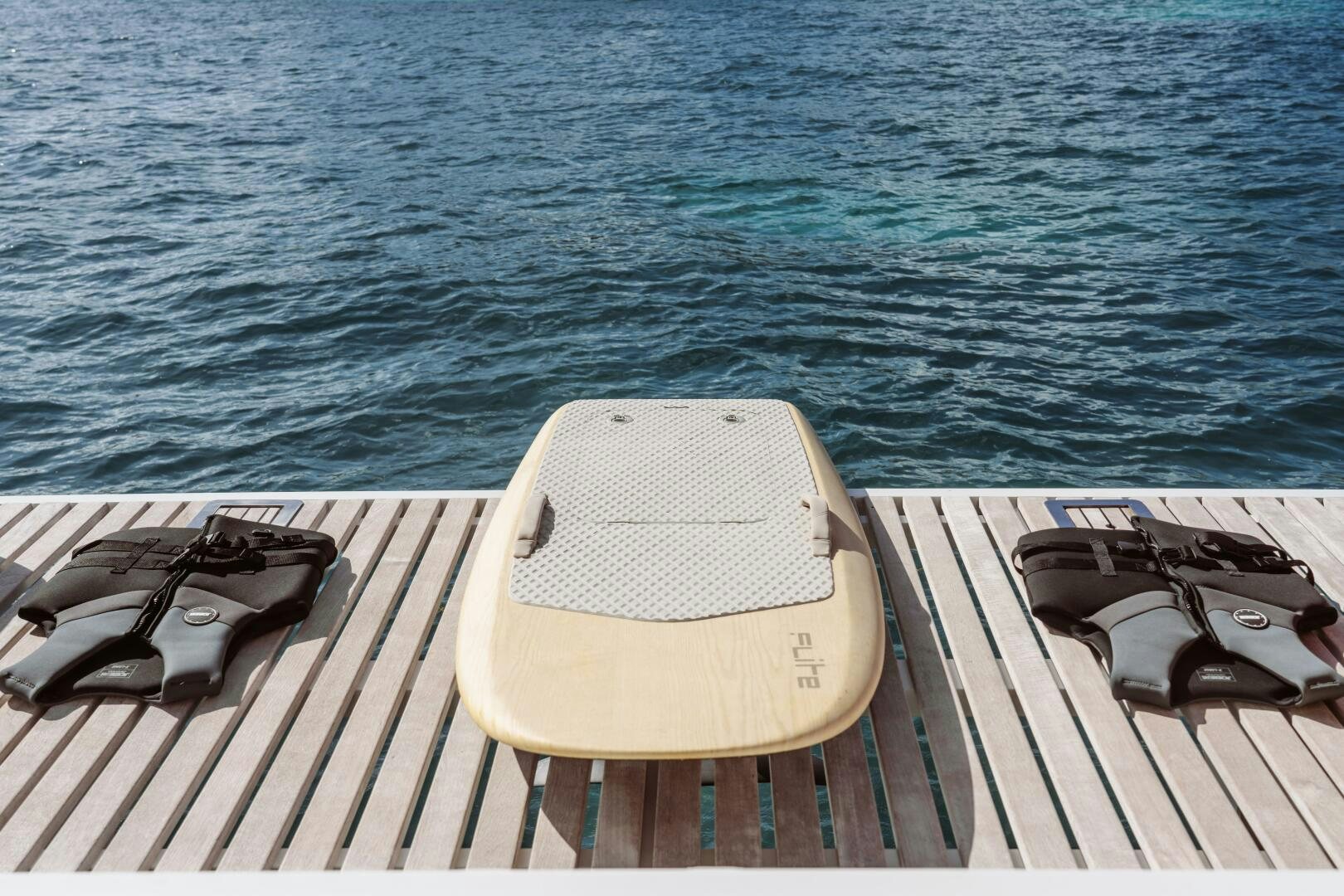 a chair on a deck overlooking the ocean aboard OCEANUS Yacht for Sale
