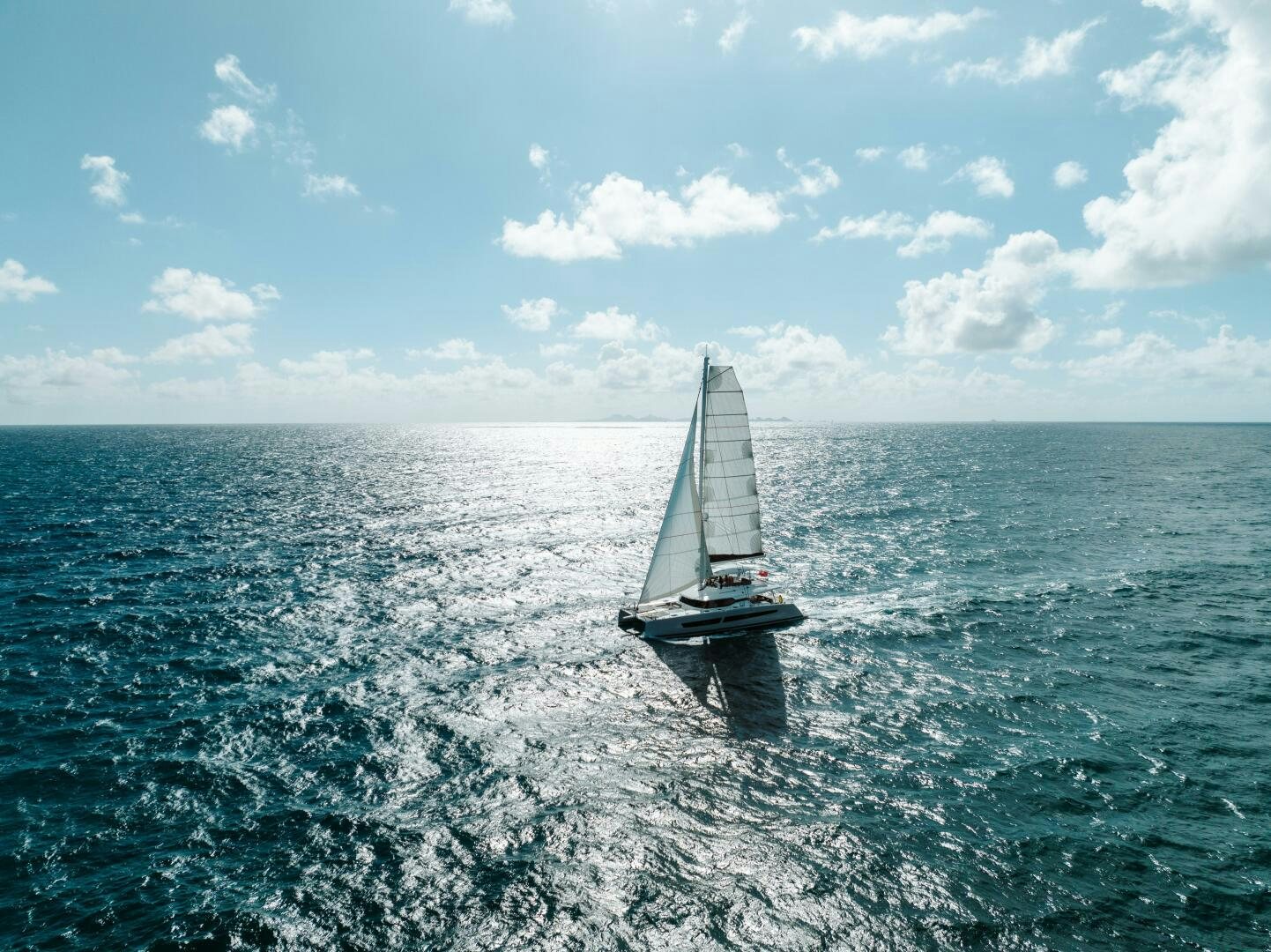 a sailboat in the water aboard OCEANUS Yacht for Sale