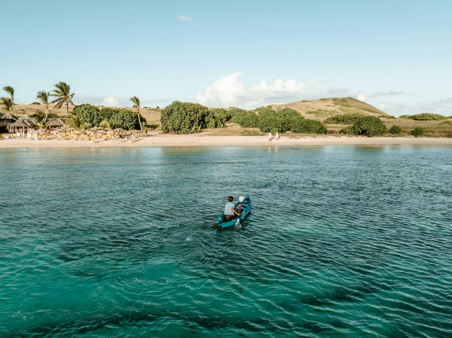 a person on a jet ski in the ocean aboard OCEANUS Yacht for Sale