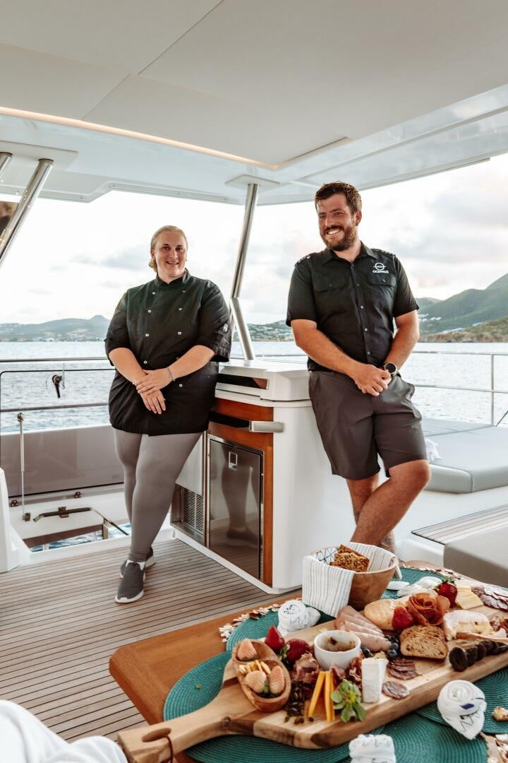 two men standing on a boat aboard OCEANUS Yacht for Sale