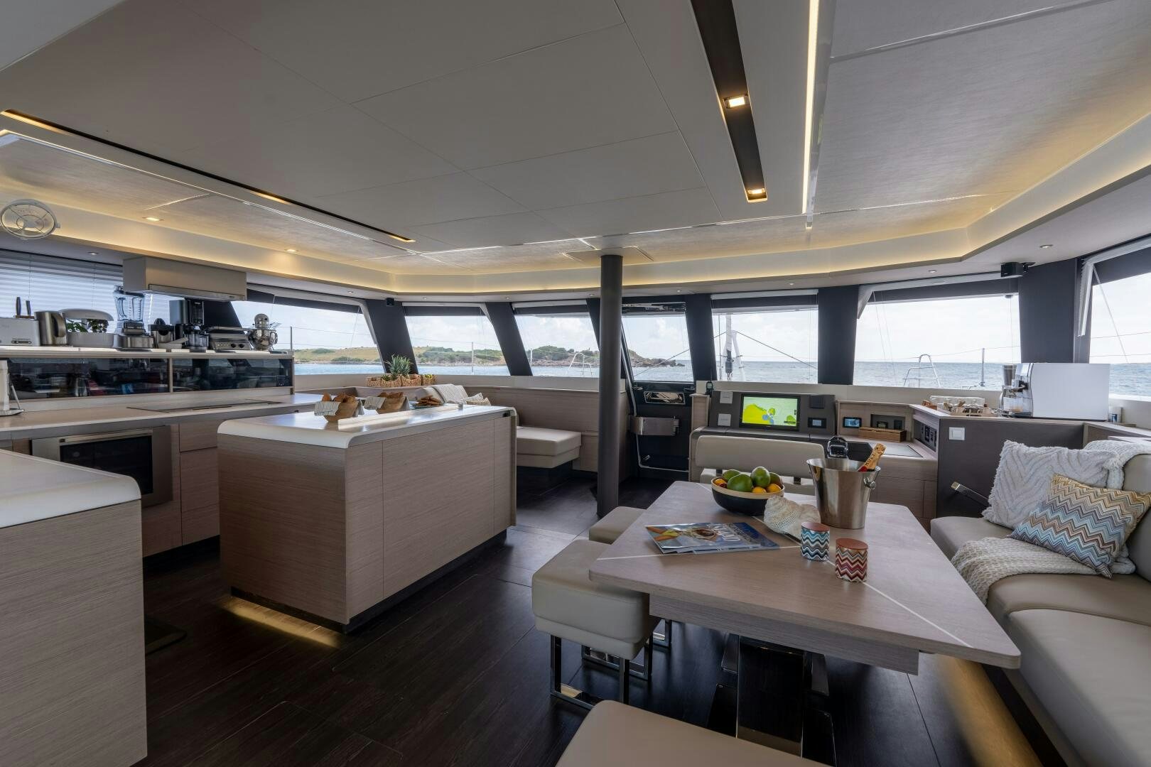 a large open kitchen and dining area aboard OCEANUS Yacht for Sale