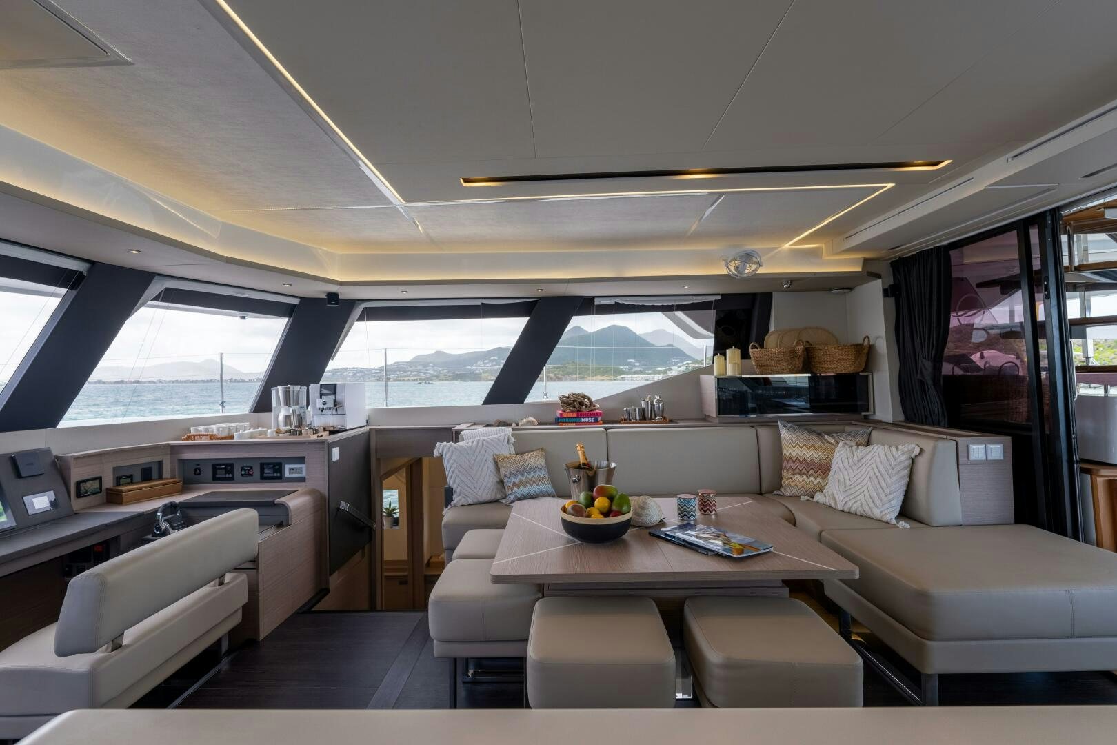 a living room with a couch and a table aboard OCEANUS Yacht for Sale