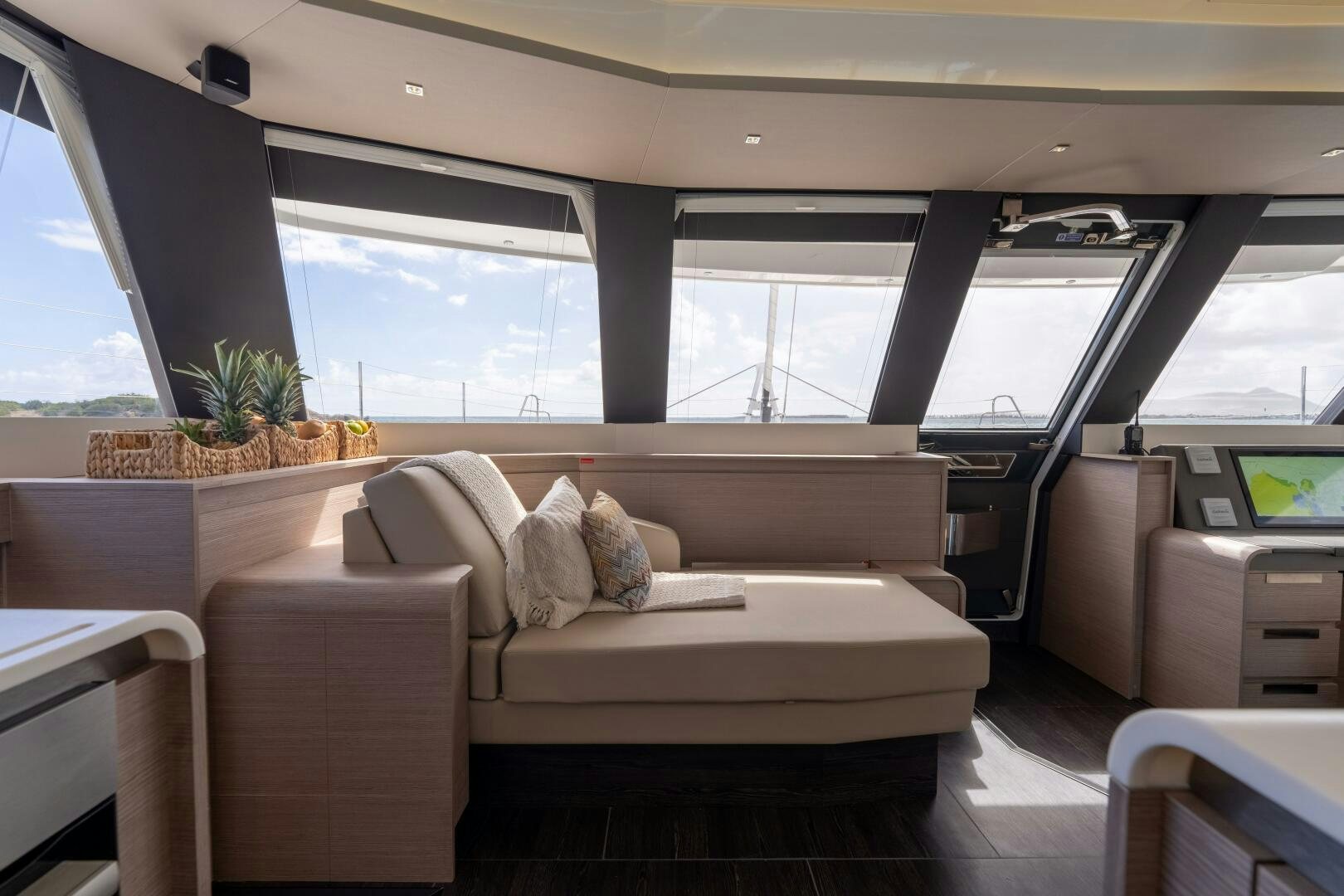 a room with a couch and a table aboard OCEANUS Yacht for Sale