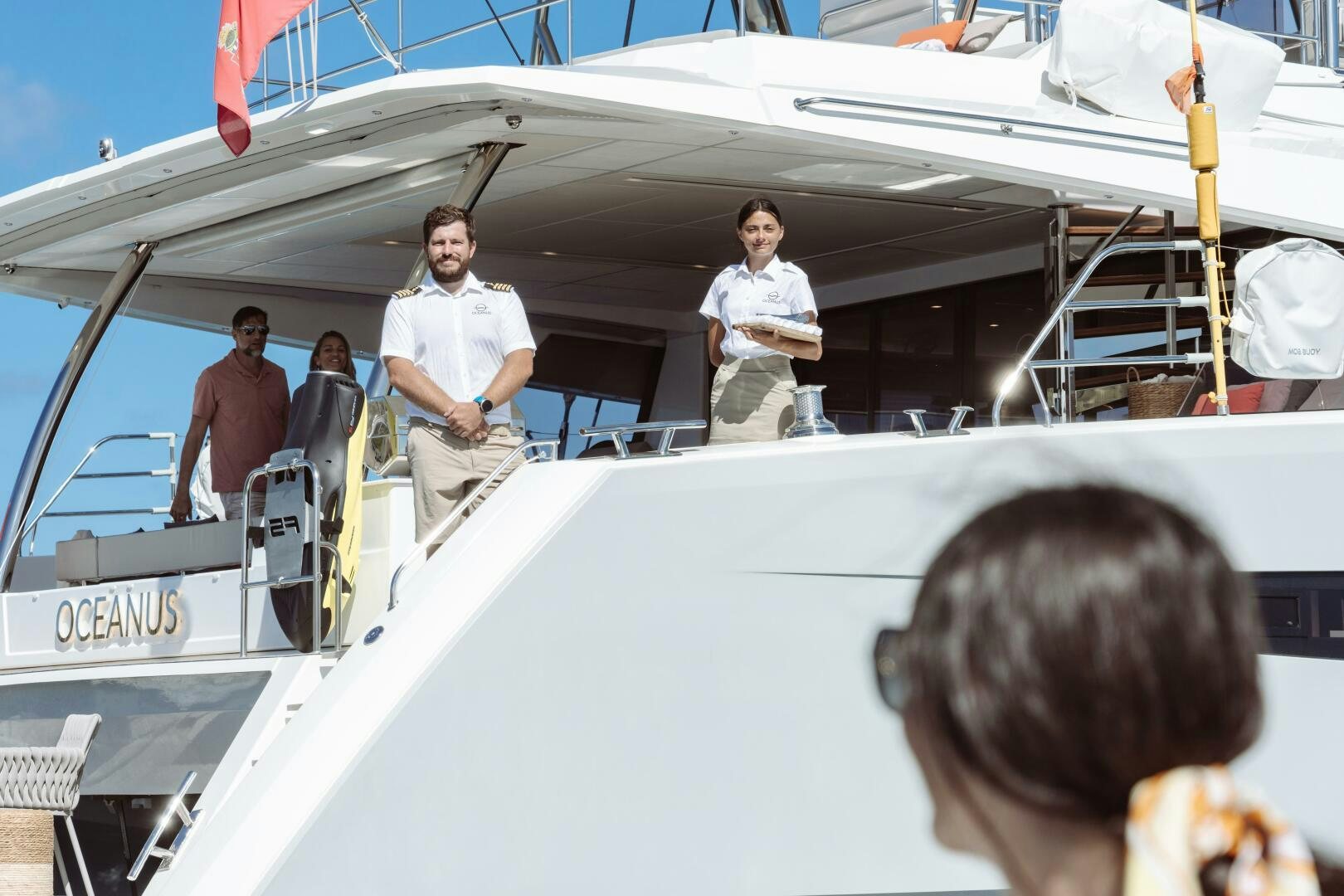 a group of people standing on a boat aboard OCEANUS Yacht for Sale