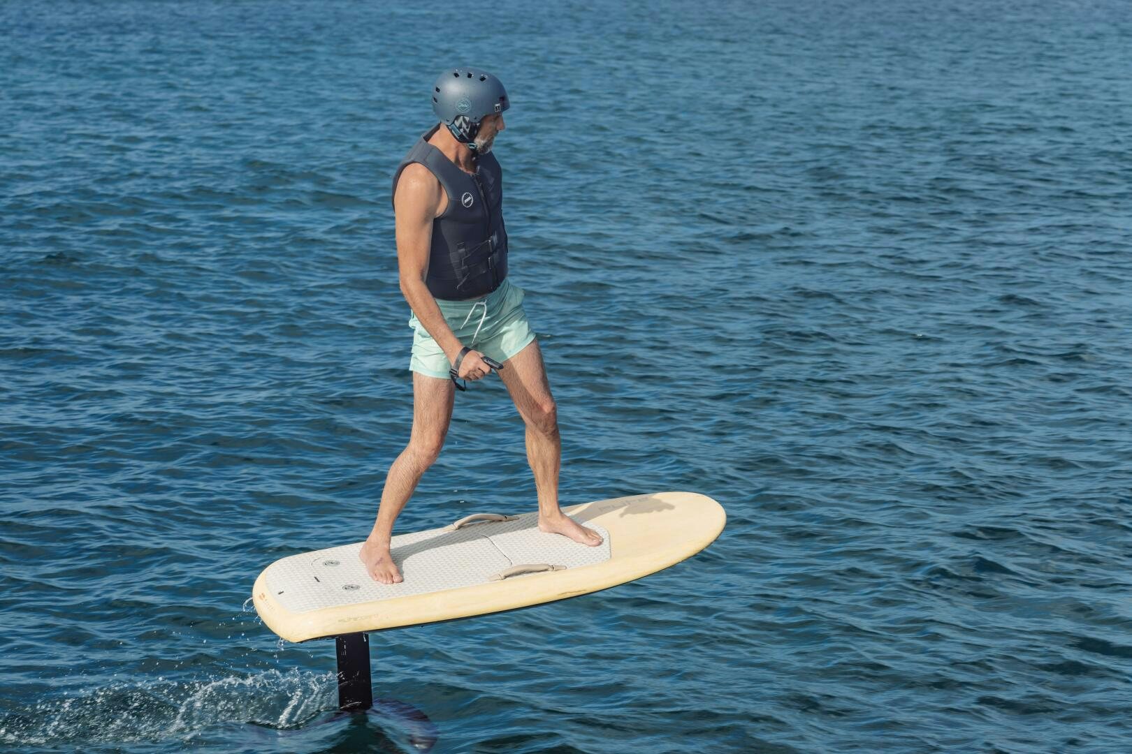 a person on a surfboard aboard OCEANUS Yacht for Sale