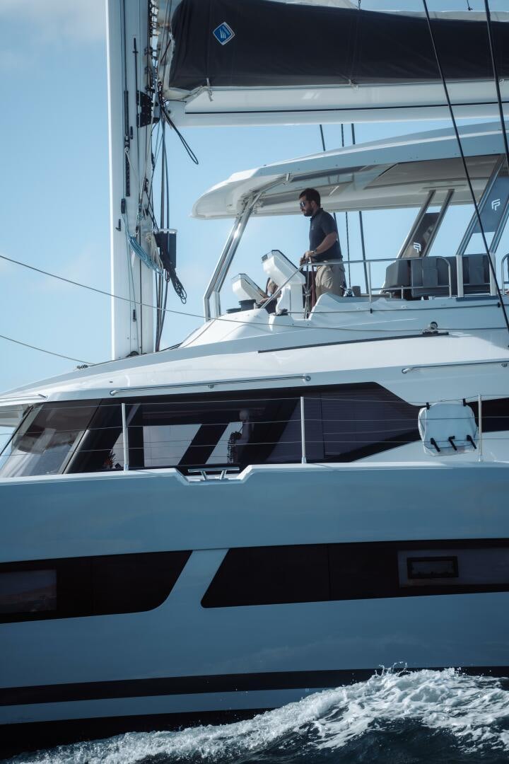 a person standing on a boat aboard OCEANUS Yacht for Sale
