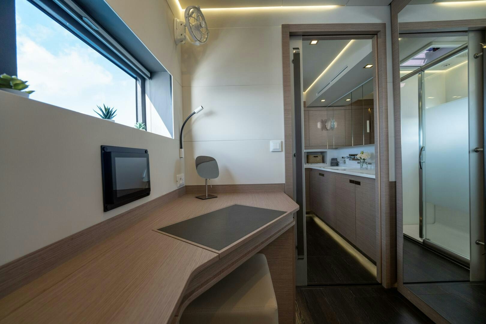 a room with a table and tv aboard OCEANUS Yacht for Sale