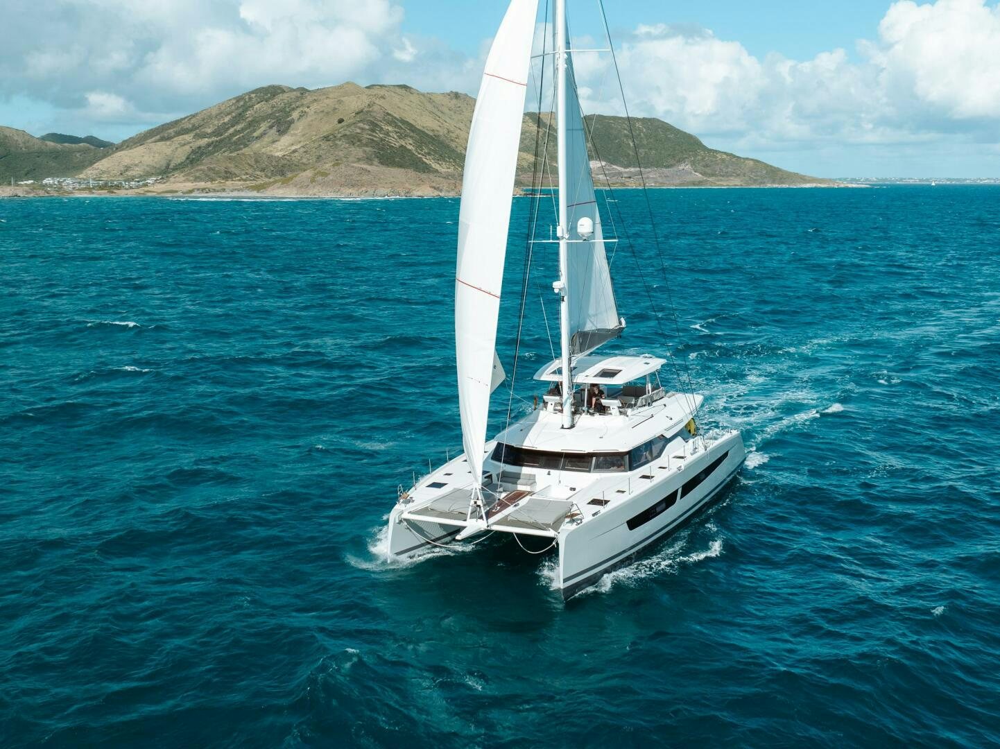 a white boat in the water aboard OCEANUS Yacht for Sale