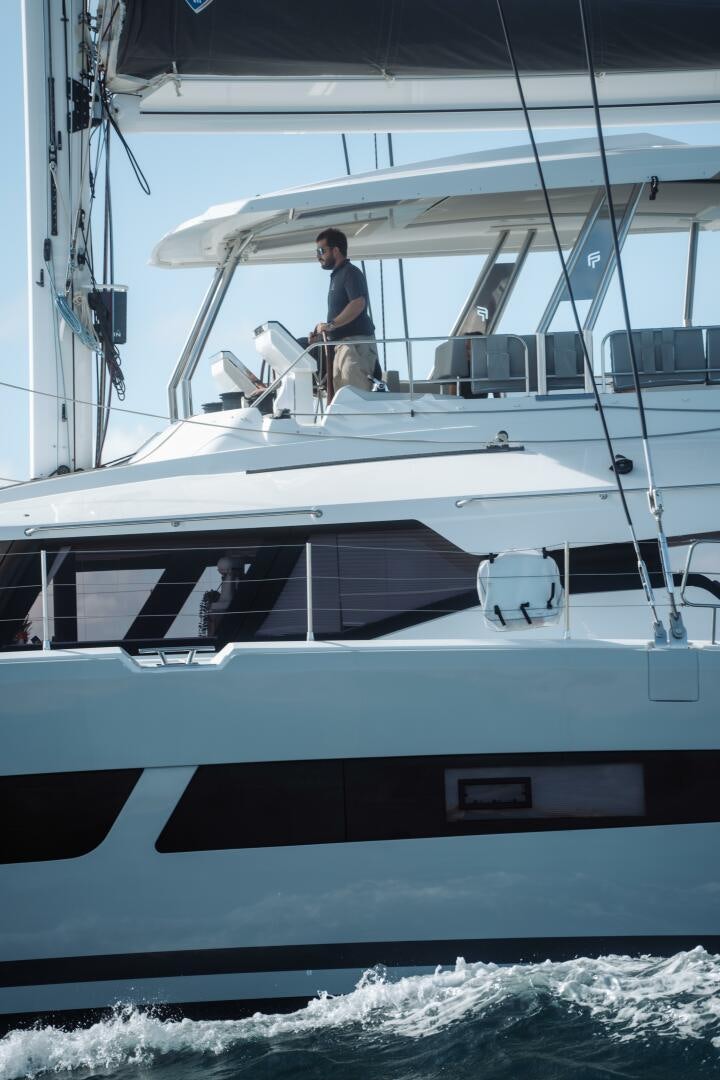 a person standing on a boat aboard OCEANUS Yacht for Sale