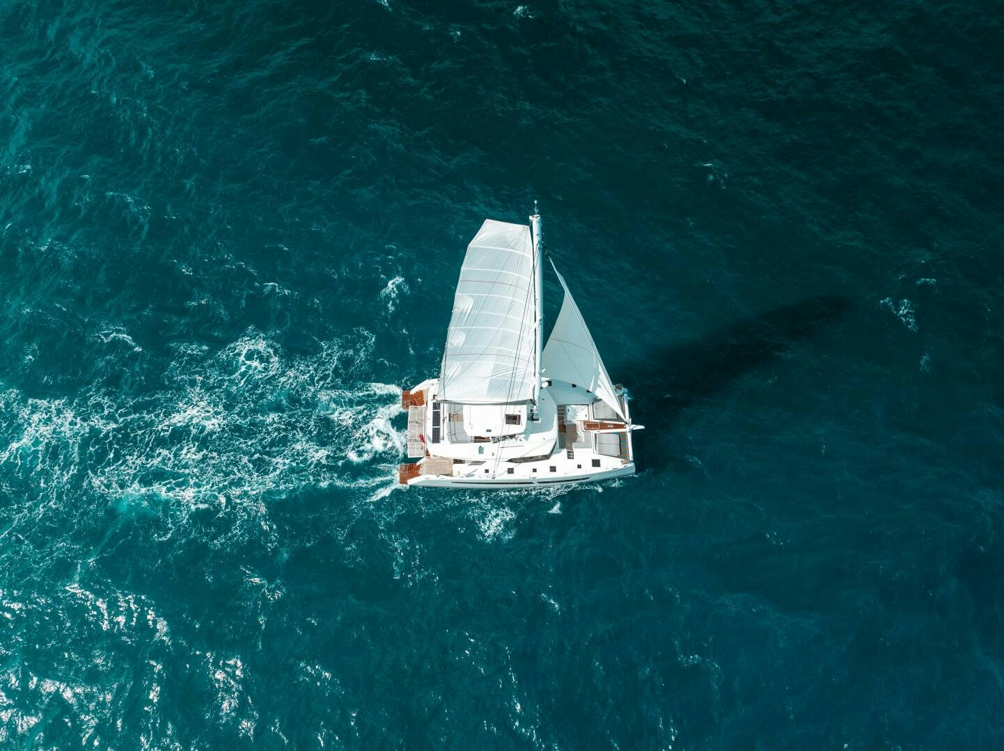 a boat sailing on the sea aboard OCEANUS Yacht for Sale