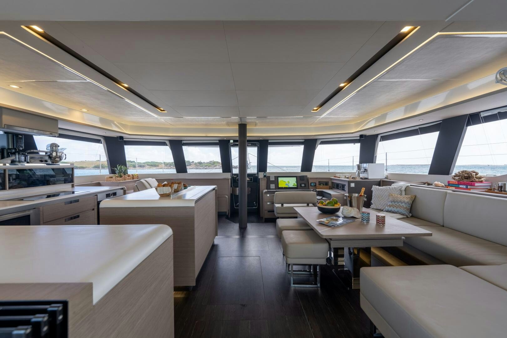 a room with a table and chairs aboard OCEANUS Yacht for Sale